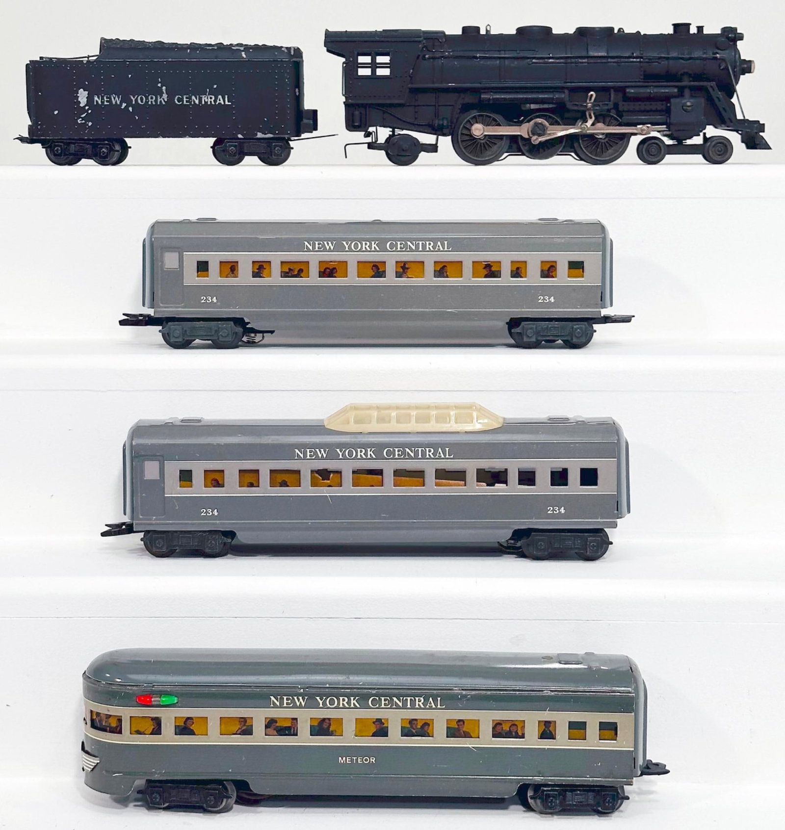 Marx Postwar O Gauge New York Central Locomotive and Tender/Three (3) Assorted NYC Passenger Cars: Marx Postwar O Gauge New York Central Locomotive and Tender with Three (3) Assorted New York Central Passenger Cars, with the 4 - 6 - 2 Locomotive in C6 plus to C7 minus, the New York Central Tender i