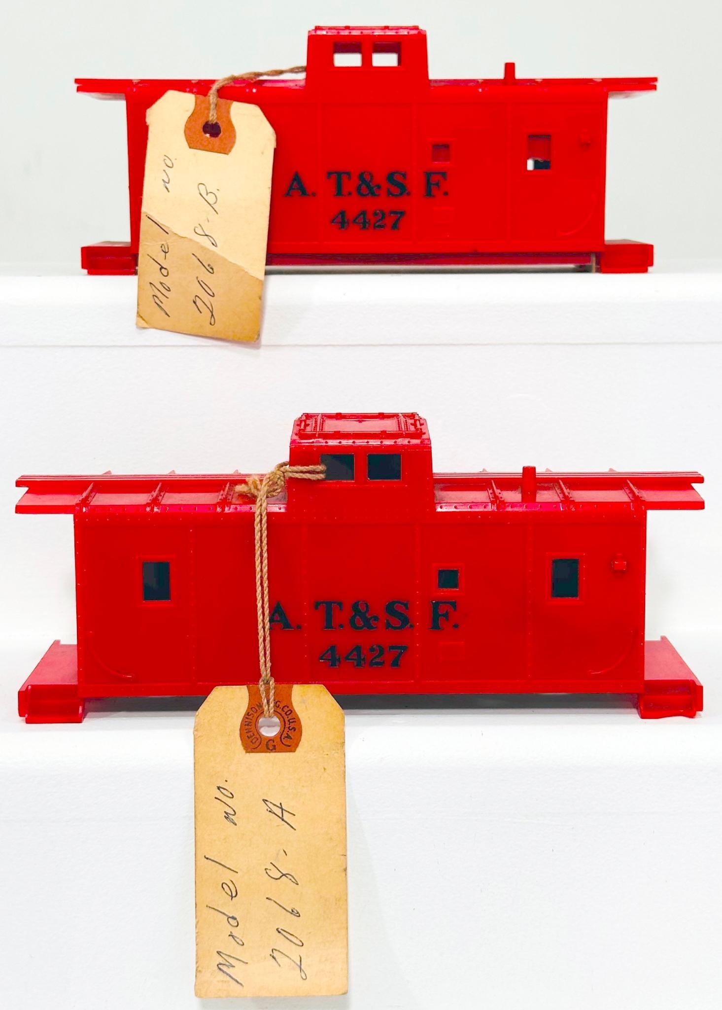 Marx Postwar O Gauge Factory Prototype AT&SF red Caboose shell only X2: Marx Postwar O Gauge Factory Prototype AT&SF red Caboose shell only X2, Model #2068A, dated November 11, 1953, in C7. This Lot also includes a Factory Prototype AT&SF red plastic Caboose shell only, M