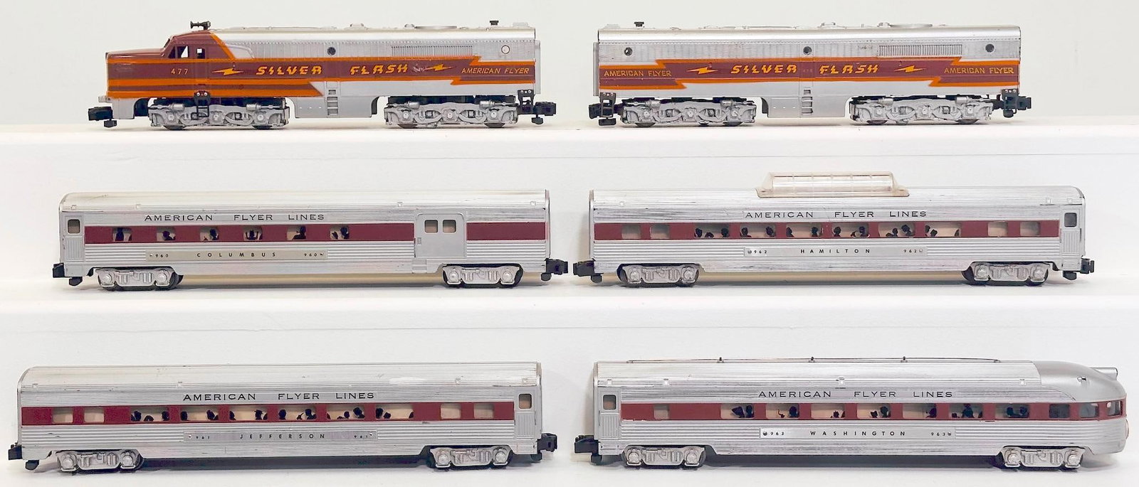 American Flyer Postwar S Gauge 477 Silver Flash A - B Alco Diesel Units and 962-963-960-961 Cars: American Flyer Postwar S Gauge 477 Silver Flash A - B Alco Diesel Units and 962 - 963 - 960 - 961 brown Stripe Window Passenger Cars, each in C7 or better. Longest item in this Lot is 14 inches.