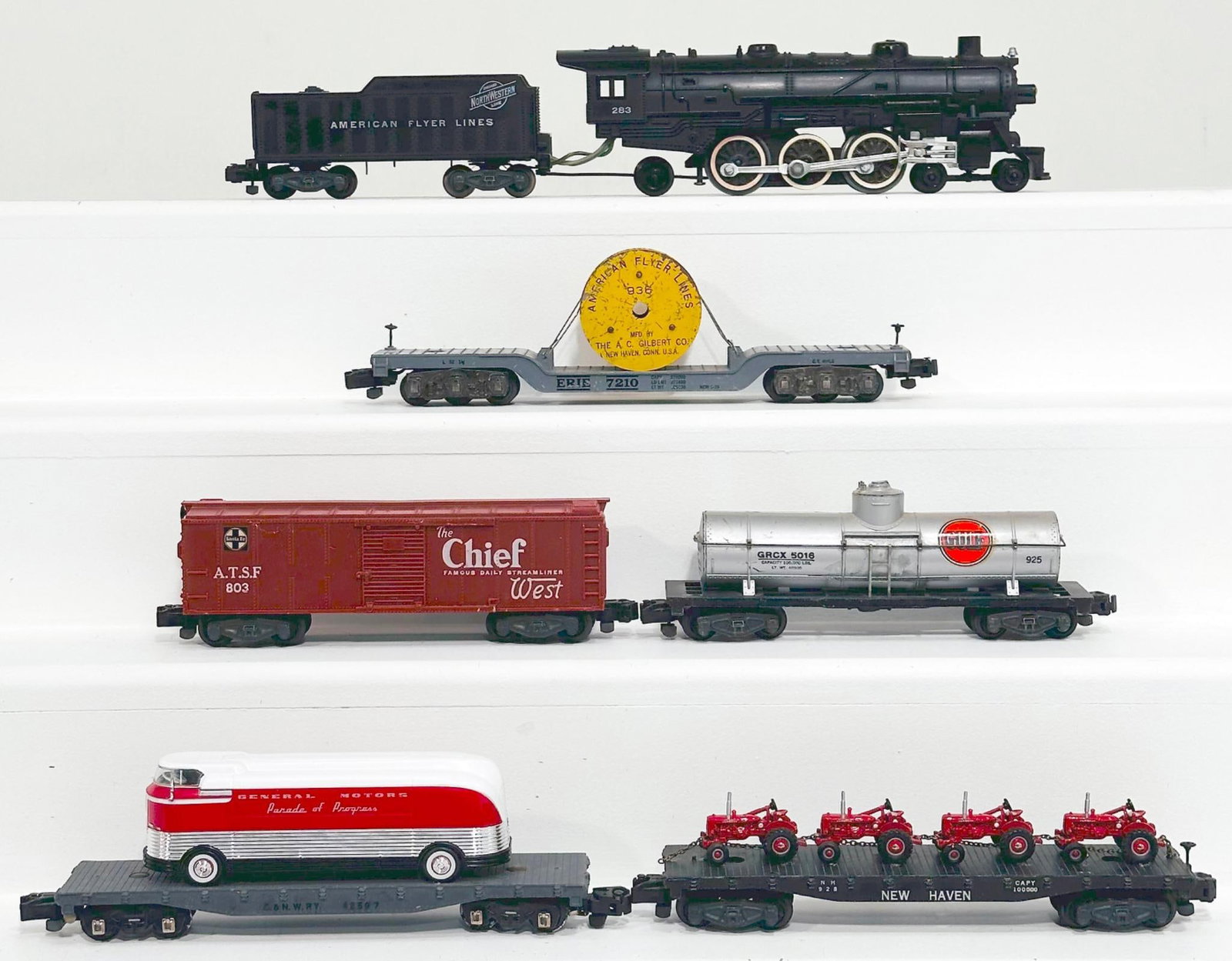 American Flyer Postwar S Gauge 283 Locomotive and Tender and Five (5) Assorted Freight Cars: American Flyer Postwar S Gauge 283 Locomotive and Tender and Five (5) Assorted Freight Cars, with the 283 in C7, a 936 in C6, 928 in C7 with four (4) tractors for load, 925 in C6, 42597 in C6 plus and