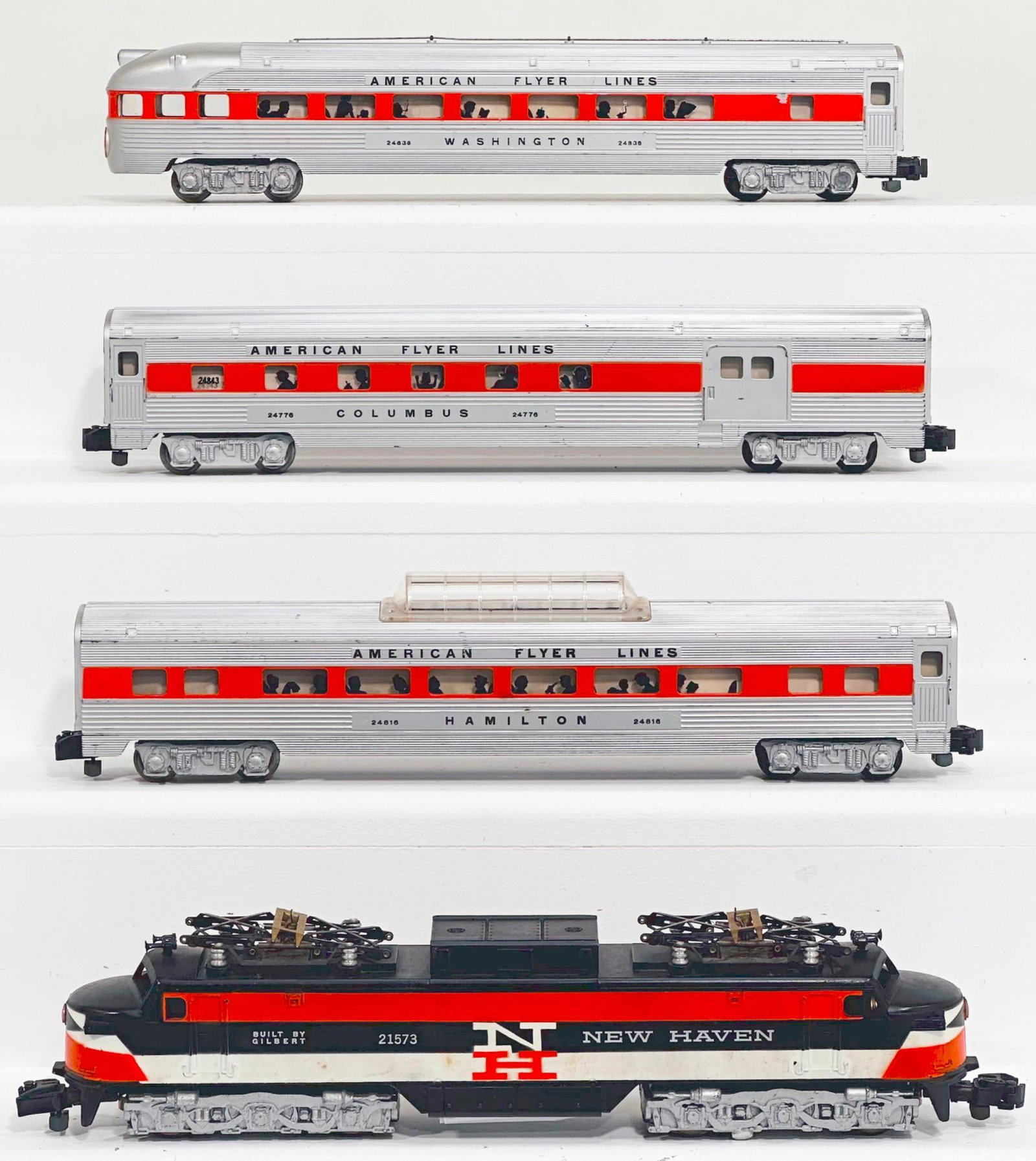 American Flyer Postwar S Gauge 21573 New Haven Electric Locomotive/24816-24776-24836 Passenger Cars: American Flyer Postwar S Gauge 21573 New Haven Electric Locomotive and 24816 - 24776 - 24836 Passenger Cars, each in C7 minus or better. Longest item in this Lot is 14 inches.