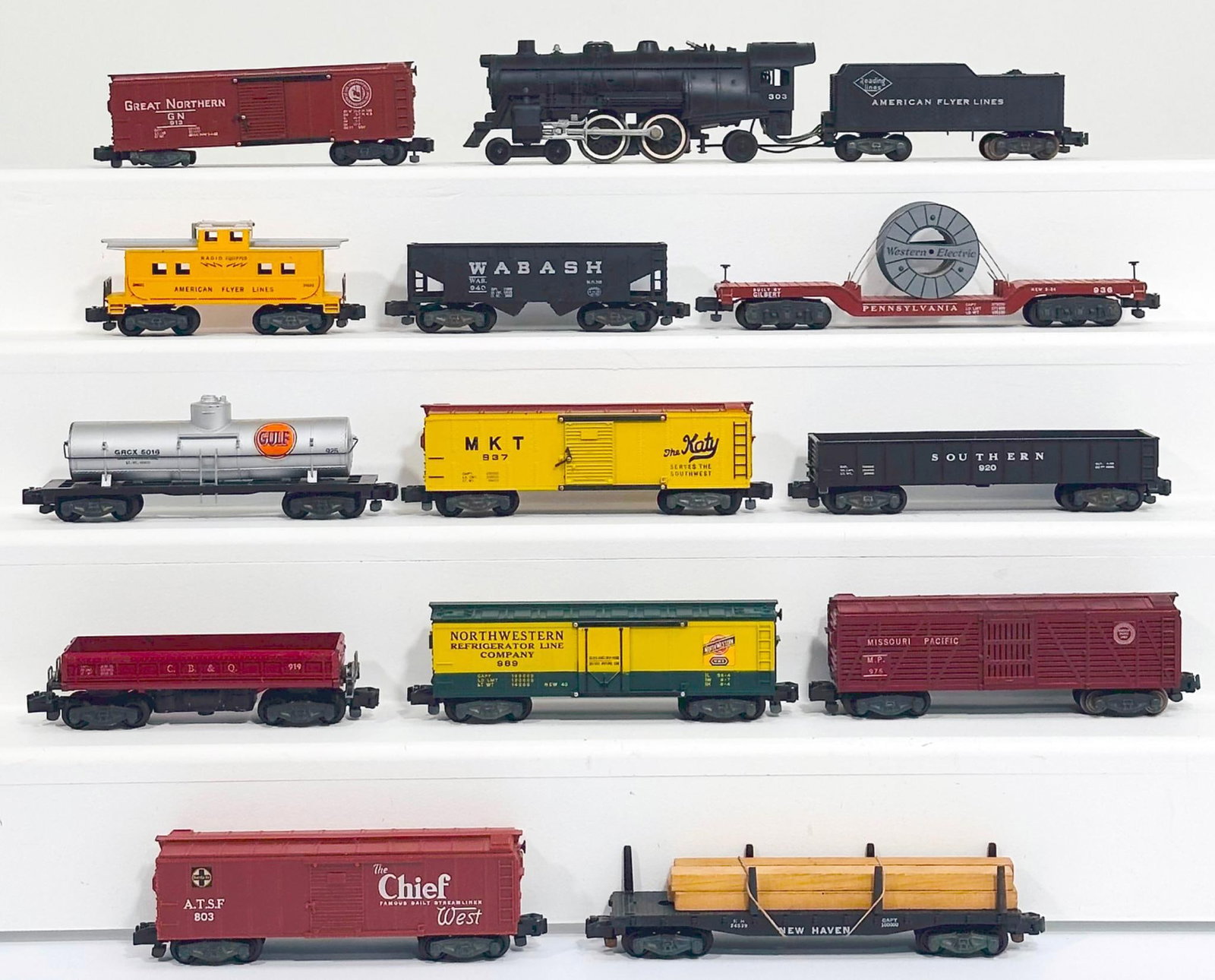 American Flyer Postwar S Gauge 303 Reading Lines 4-4-2 Locomotive and Tender and Twelve (12) Cars: American Flyer Postwar S Gauge 303 Reading Lines 4 - 4 - 2 Locomotive and Tender and Twelve (12) Assorted Freight Cars, with the 303 in C7, and including 925 in C7, 920 in C7, 919 in C7 minus, 976 in 