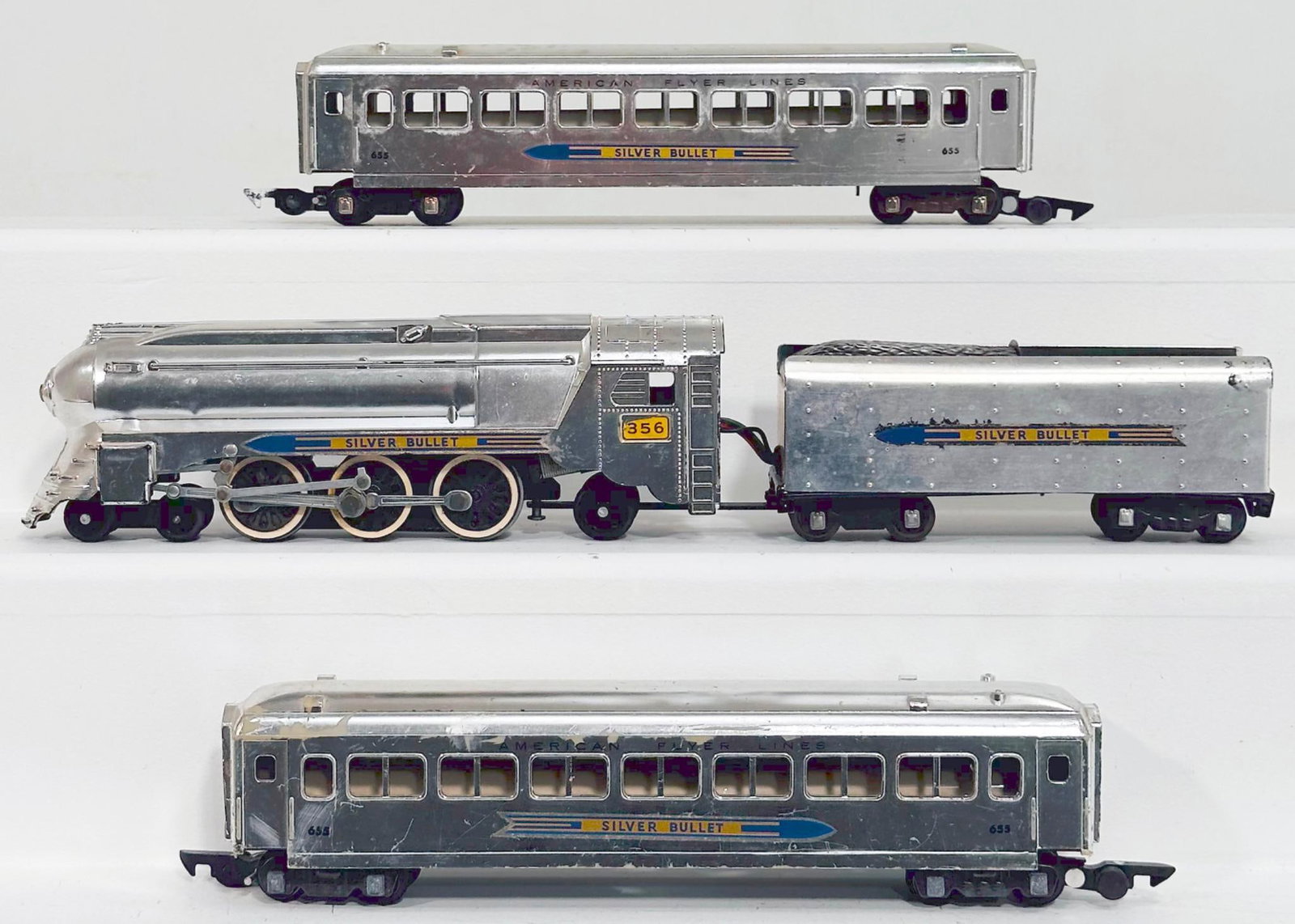 American Flyer Postwar S Gauge 356 Silver Bullet 4-6-2 Locomotive and Tender/655-655 Passenger Cars: American Flyer Postwar S Gauge 356 Silver Bullet 4 - 6 - 2 Locomotive and Tender and 655 - 655 Silver Bullet Passenger Cars, each in C6 plus to C7 minus. The longest item in this Lot is 17 inches.
