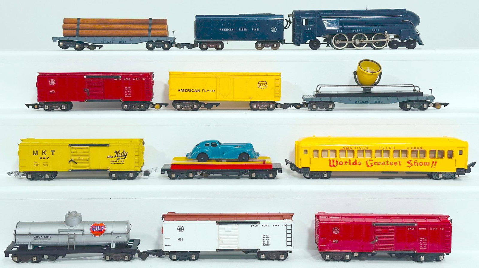 American Flyer Postwar S Gauge 350 Royal Blue Locomotive and Tender/Circus Passenger Car/Nine Cars: American Flyer Postwar S Gauge 350 Royal Blue Locomotive and Tender/Circus Passenger Car and Nine (9) Assorted Freight Cars, with the 350 in C6 plus to C7 minus, the Circus Passenger Car in C7, the 63
