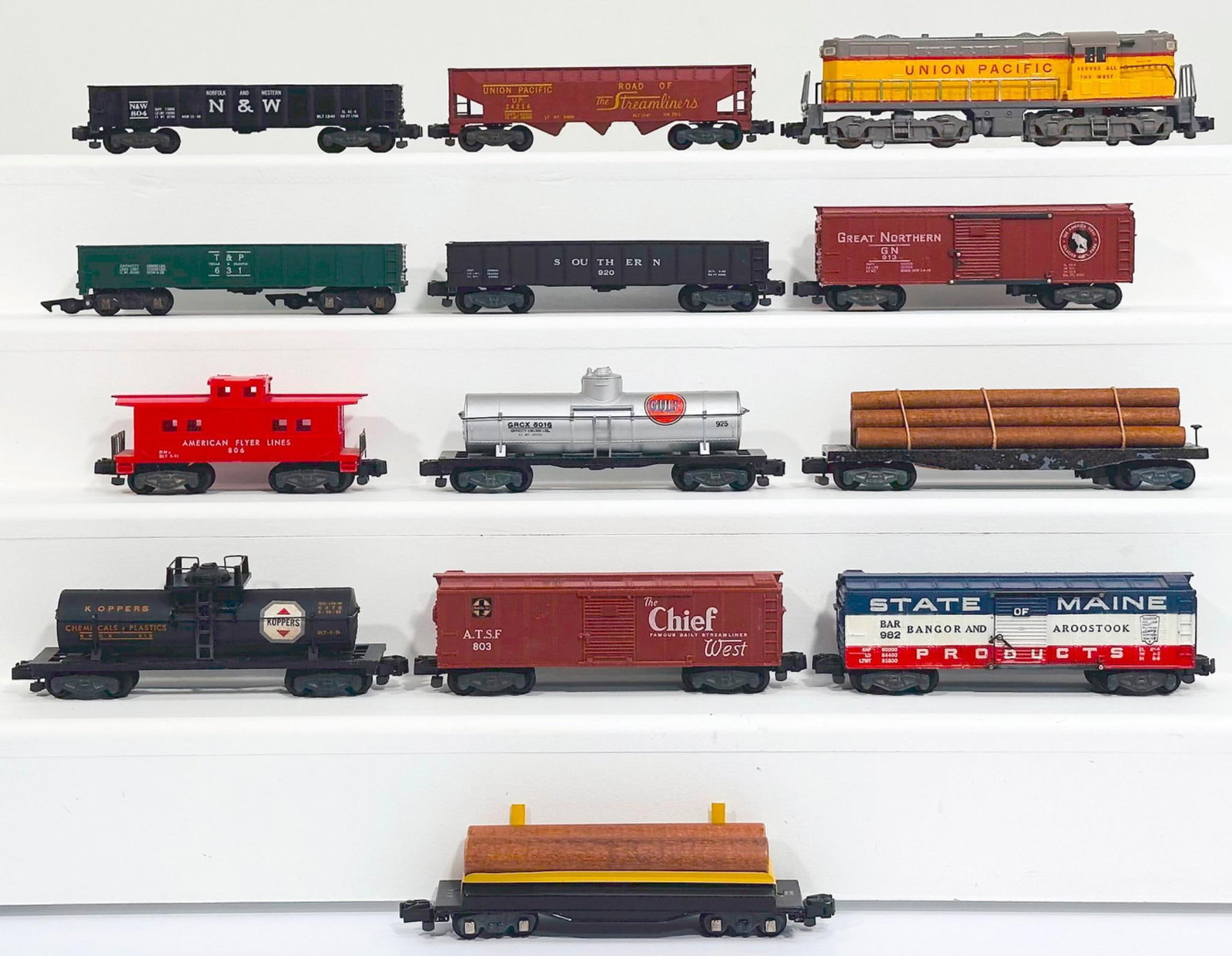 American Flyer Postwar S Gauge 372 Union Pacific Switcher and Twelve (12) Assorted Freight Cars: American Flyer Postwar S Gauge 372 Union Pacific Switcher and Twelve (12) Assorted Freight Cars, with the 372 in C7, and including 804 in C7, 925 in C7, 803 in C7, Flat Car with lumber load in C5 repa