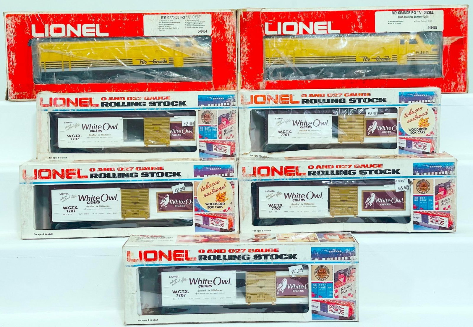 Lionel Modern O Gauge Rio Grande F-3 A Diesel Unit/A Nonpowered Dummy Unit and White Owl Box Car X5: Lionel Modern O Gauge Rio Grande F - 3 A Diesel Unit and A Nonpowered Dummy Unit and White Owl Box Car X5, each in C8 or better and each with its original box, with all of the boxes showing moderate