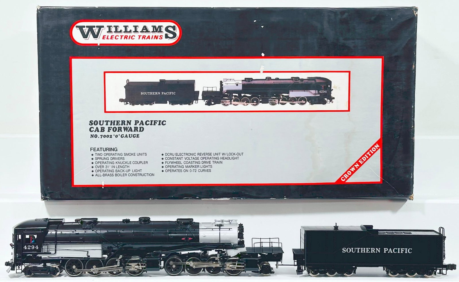 Williams Modern O Gauge "Crown Edition" Southern Pacific Cab Forward Locomotive and Tender Boxed: Williams Modern O Gauge "Crown Edition" Southern Pacific Cab Forward Locomotive and Tender Boxed, in C8 or better and with its original box. The original box shows moderate to heavy wear.