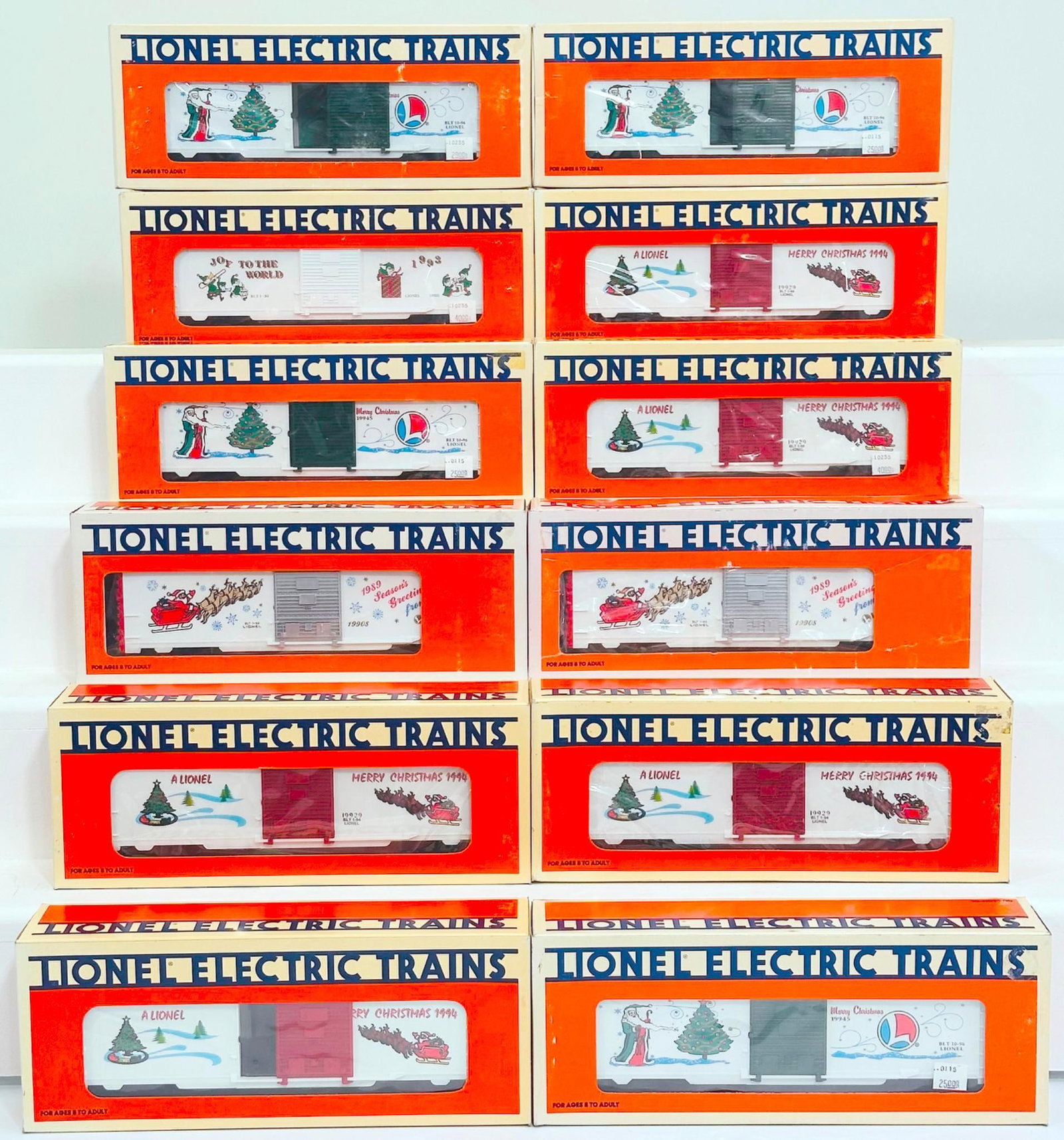 Lionel Modern O Gauge Twelve (12) Assorted Freight Cars Boxed: Lionel Modern O Gauge Twelve (12) Assorted Freight Cars Boxed, including 1996 Holiday Box Car, O Gauge Christmas Box Car X5, 1989 Christmas Car, 1989 Christmas Car, 1993 O Gauge Christmas Box Car, 199