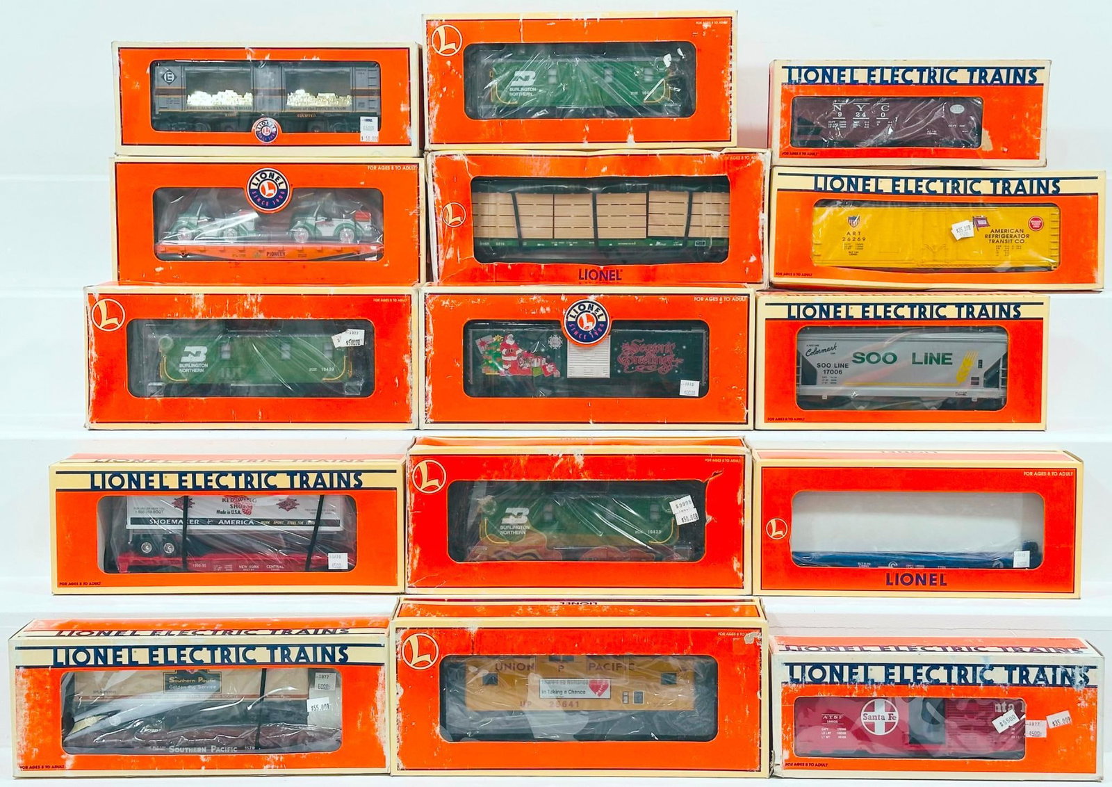 Lionel Modern O Gauge Fifteen (15) Assorted Freight Cars Boxed: Lionel Modern O Gauge Fifteen (15) Assorted Freight Cars Boxed, including New York Central Operating Hopper, Metca TCA 2014 Division Car, Erie Lackawanna Mint Car, Red Wing Shoes Flat Car with Trailer