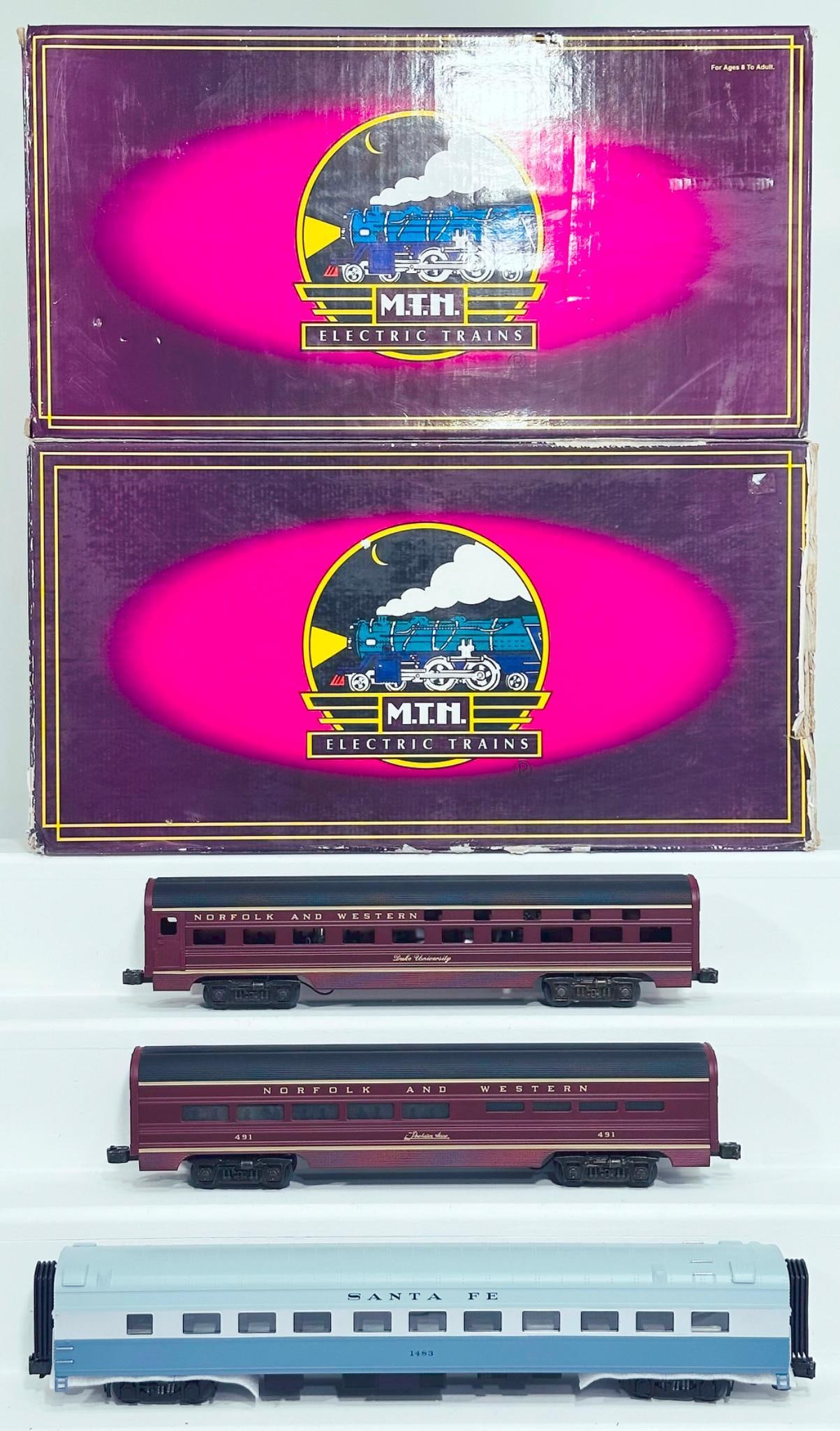 MTH Modern O Gauge Santa Fe 2 Car 70 foot ABS Sleeper/Diner Passenger Set/Norfolk & Western Set: MTH Modern O Gauge Santa Fe 2 Car 70 foot ABS Sleeper/Diner Passenger Set smooth side and Norfolk and Western Painted 60 foot Aluminum Sleeper/Diner Set Boxed, each in C8 or better and each with its o