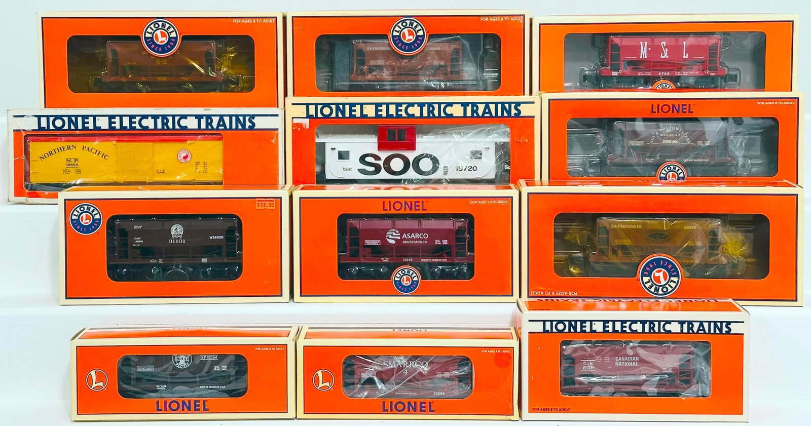 Lionel Modern O Gauge Twelve (12) Assorted Freight Cars Boxed: Lionel Modern O Gauge Twelve (12) Assorted Freight Cars Boxed, including Union Pacific Ore Car, GPD TTON 02 Ore Car X2, 2011 Gadsen - Pacific Asarco Ore Car, Soo Line Extended Vision Caboose, Canadian