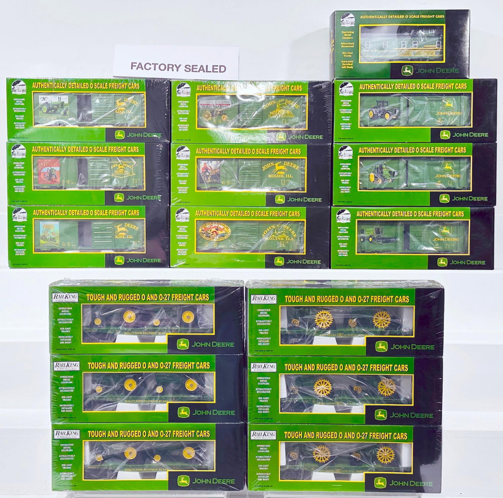 MTH Modern O Gauge John Deere Sixteen (16) Assorted Freight Cars Boxed: MTH Modern O Gauge John Deere Sixteen (16) Assorted Freight Cars Boxed, including 40 foot Box Car X6 Sealed Boxes/John Deere Flat Car with Tractors X3 Sealed Boxes/ John Deere Flat Car with Model Trac