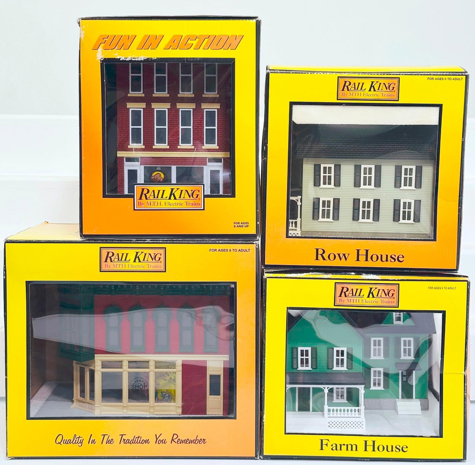 MTH Rail King Modern O Gauge Farmhouse/3 Story Pet Store with blinking sign/Row House/Baker Shop: MTH Rail King Modern O Gauge Farmhouse/3 Story Pet Store with blinking sign/Row House/Baker Shop Corner Building Boxed, each in C9 and each with its original box.