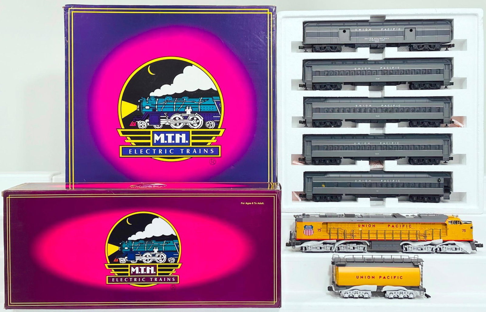 MTH Modern O Gauge Union Pacific Veranda Turbine with PS 1.0/Union Pacific 5 Car Madison Set: MTH Modern O Gauge Union Pacific Veranda Turbine with PS 1.0 and Union Pacific 5 Car Madison Passenger Set Boxed, each in C9 and each with its original box.
