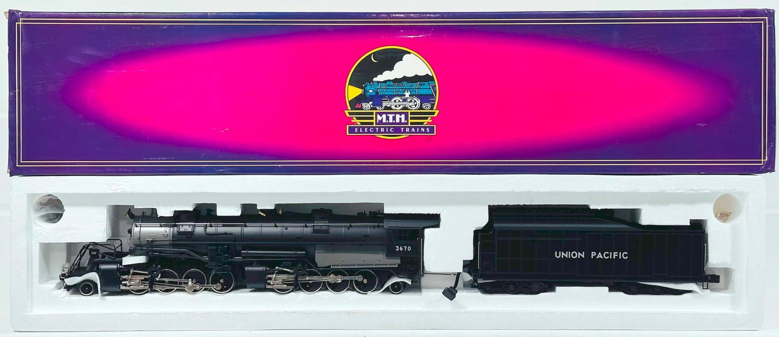 MTH Modern O Gauge Union Pacific 2-8-8-2 Diecast Mallet Locomotive and Tender with PS 1.0 Boxed: MTH Modern O Gauge Union Pacific 2 - 8 - 8 - 2 Diecast Mallet Locomotive and Tender with PS 1.0 Boxed, in C9 and with its original box.