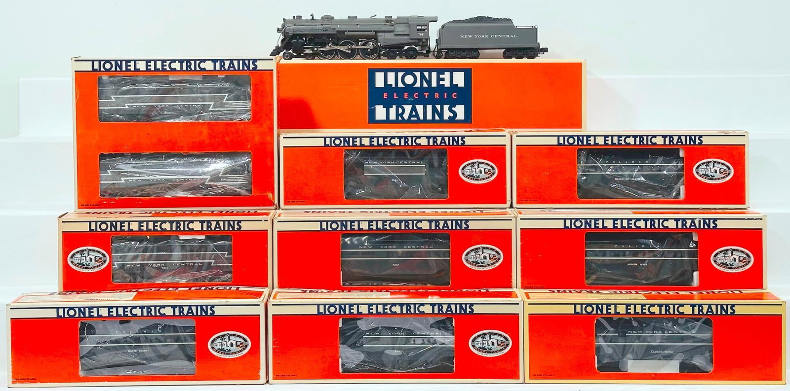Lionel Modern O Gauge Assorted Diesel Units, NYC Locomotive and Tender/Assorted Passenger Cars Boxed: Lionel Modern O Gauge New York Central F - 3 A - A Diesel Units and New York Central F3 - B Dummy Unit with electronic diesel horn/NYC 4 - 6 - 4 Hudson Locomotive and Tender/Seven (7) Assorted NYC Pas