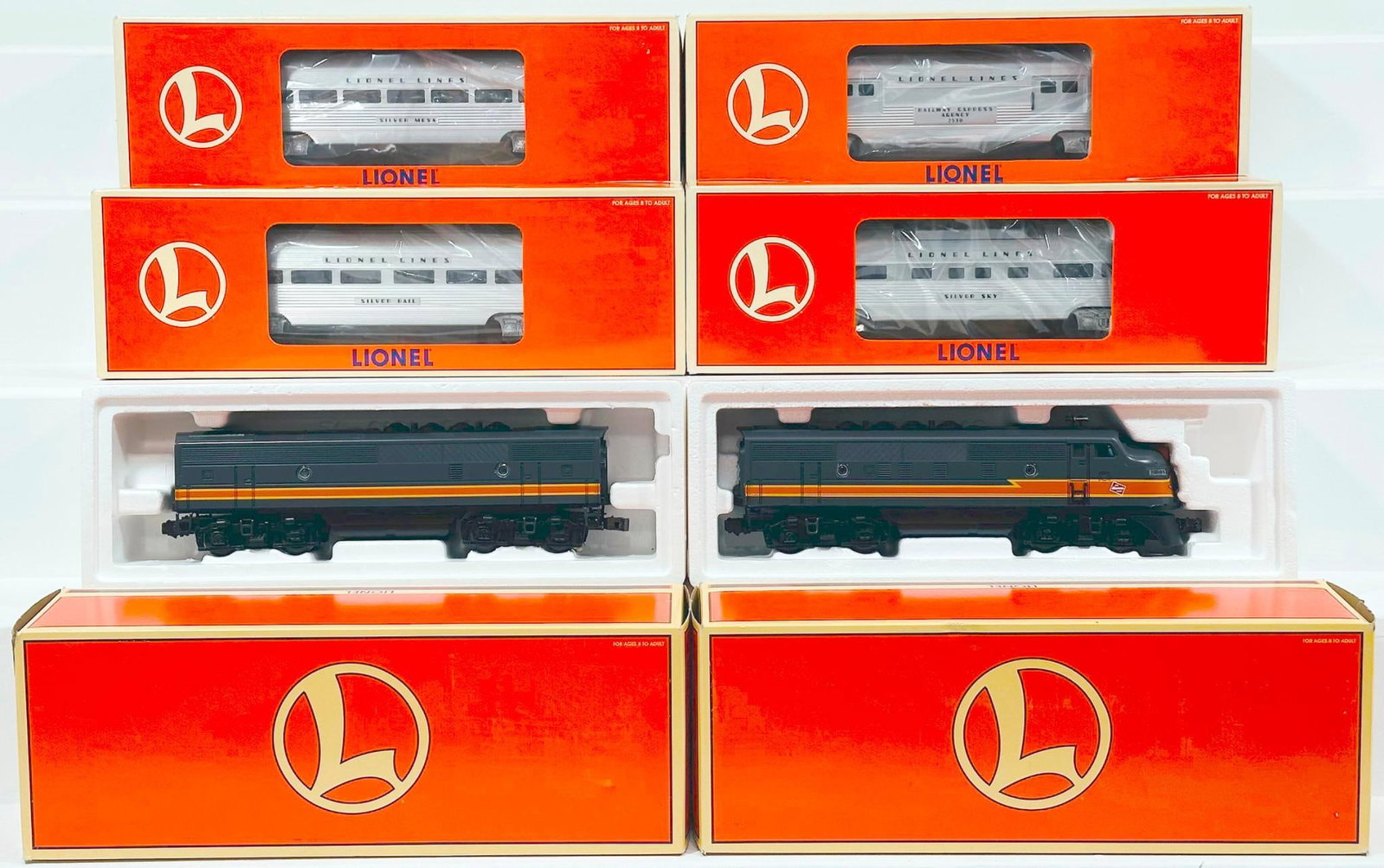 Lionel Modern O Gauge Milwaukee Road F-3 A Diesel Locomotive/Milwaukee Road F-3 B Diesel Unit/4 Cars: Lionel Modern O Gauge Milwaukee Road F - 3 A Diesel Locomotive and Milwaukee Road F - 3 B Diesel Unit and Four (4) Assorted Lionel Lines Aluminum Passenger Cars Boxed, each in C8 to C9 and each with i