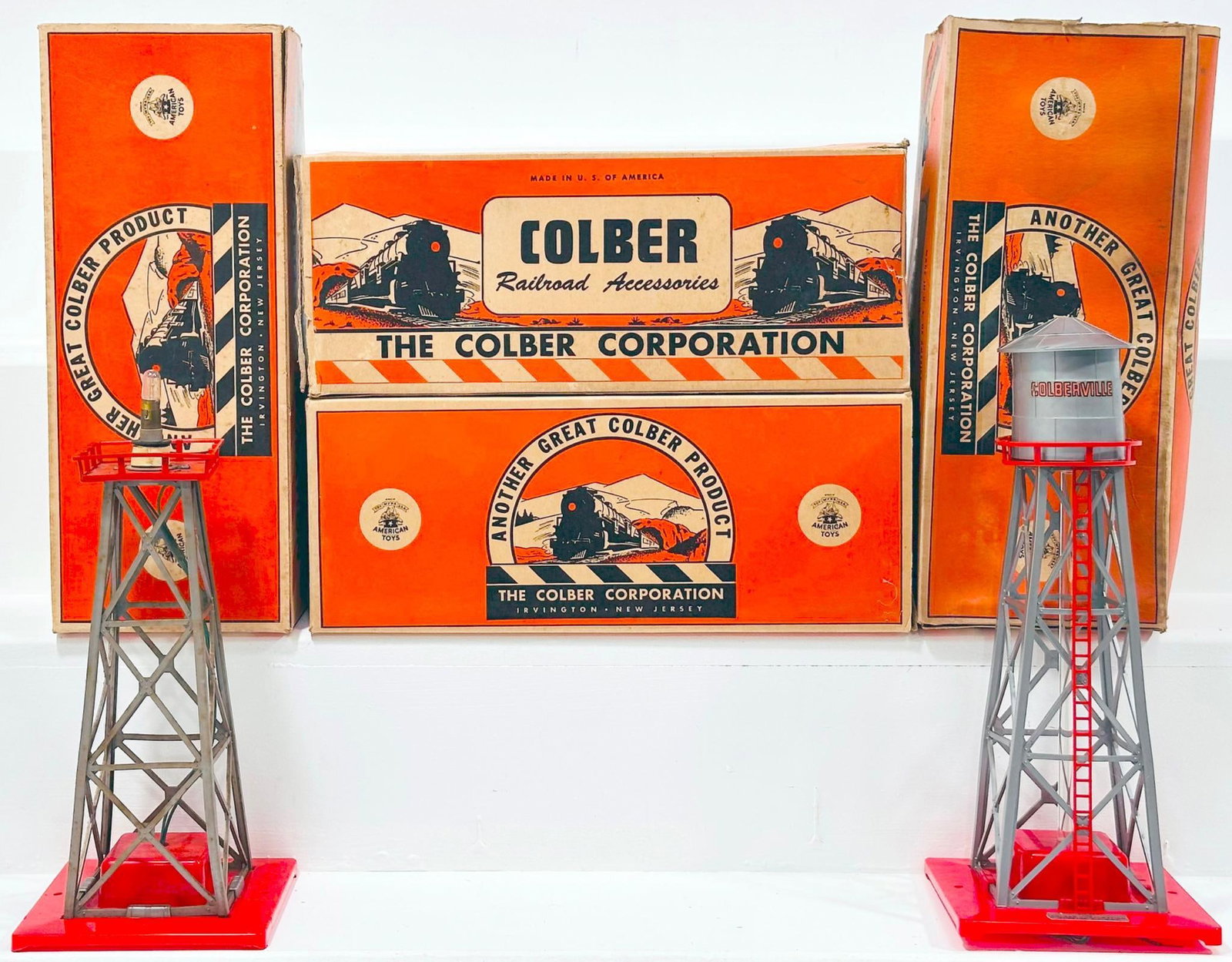 Colber Postwar 108 Water Tower Boxed X3 and 116 Mechanical Rotating Beacon Boxed: Colber Postwar 108 Water Tower Boxed X3 and 116 Mechanical Rotating Beacon Boxed, each in C7 or better and each with its original box, although there are some end flap issues for some of the boxes as 