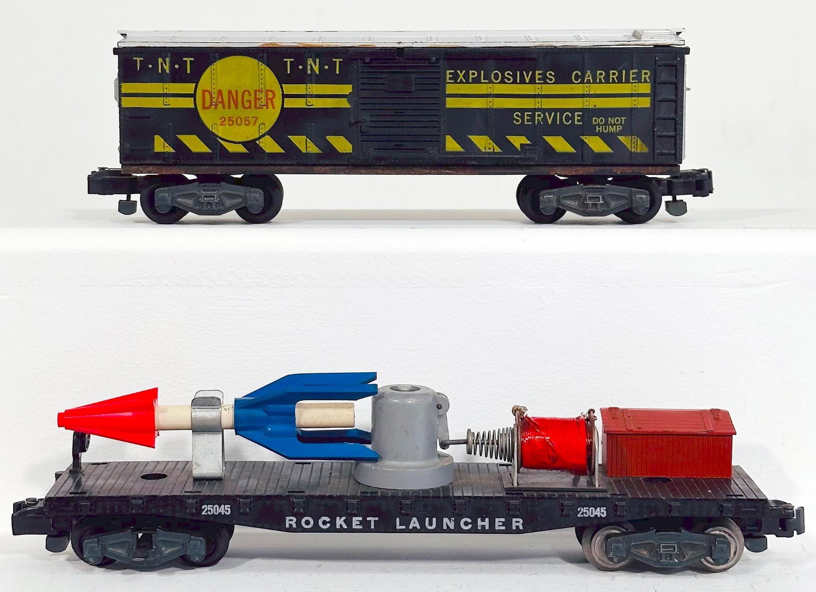 American Flyer Postwar S Gauge 25045 Rocket Launcher Car and 25057 TNT Box Car: American Flyer Postwar S Gauge 25045 Rocket Launcher Car and 25057 TNT Box Car, each in C7 or better.
