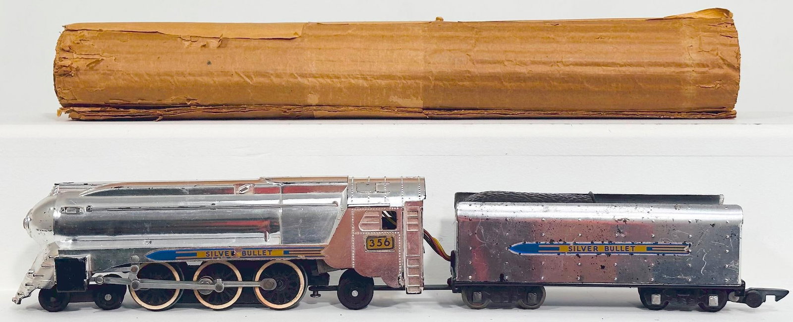 American Flyer Postwar S Gauge 356 Silver Bullet Locomotive and Tender: American Flyer Postwar S Gauge 356 Silver Bullet Locomotive and Tender, in C6 plus for the Locomotive and C6 for the Tender, and comes with original wrap.