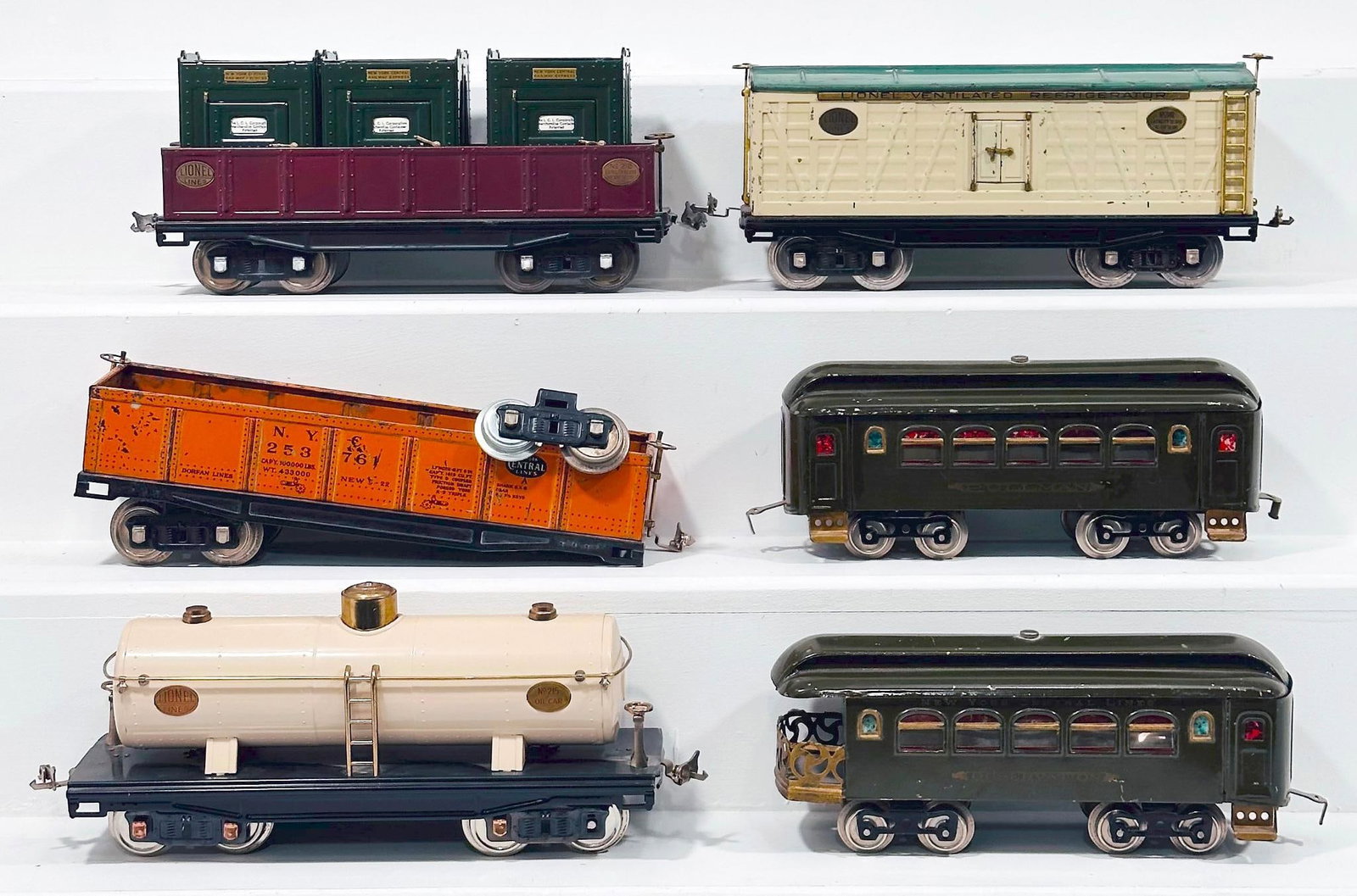 Lionel Prewar Standard Gauge Five Assorted Freight Cars and Passenger Cars and Dorfan Prewar Gondola: Lionel Prewar Standard Gauge Five (5) Assorted Freight Cars and Passenger Cars and Dorfan Prewar Wide Gauge Gondola, with some Repainted and others in C5 to C6. This is a General Condition Lot, meanin