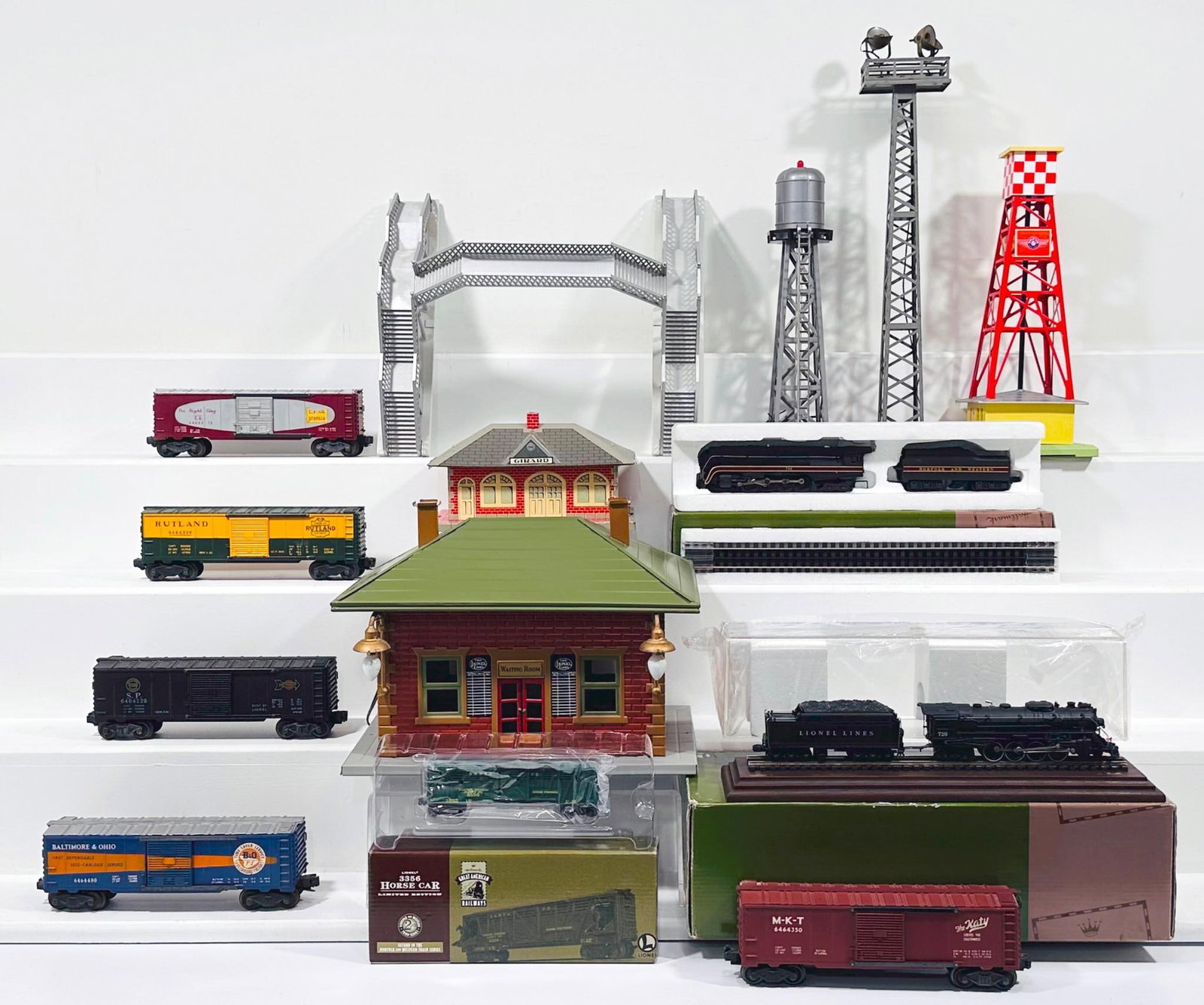 Lionel/Multiple Manufacturers Postwar and Modern Assorted Accessories and Stations and 6464 Box Cars: Lionel/ Multiple Manufacturers Postwar and Modern Assorted Accessories and Stations and 6464 Box Cars (5), in C6 to C7. This is a General Condition Lot, meaning we have not graded or examined every it