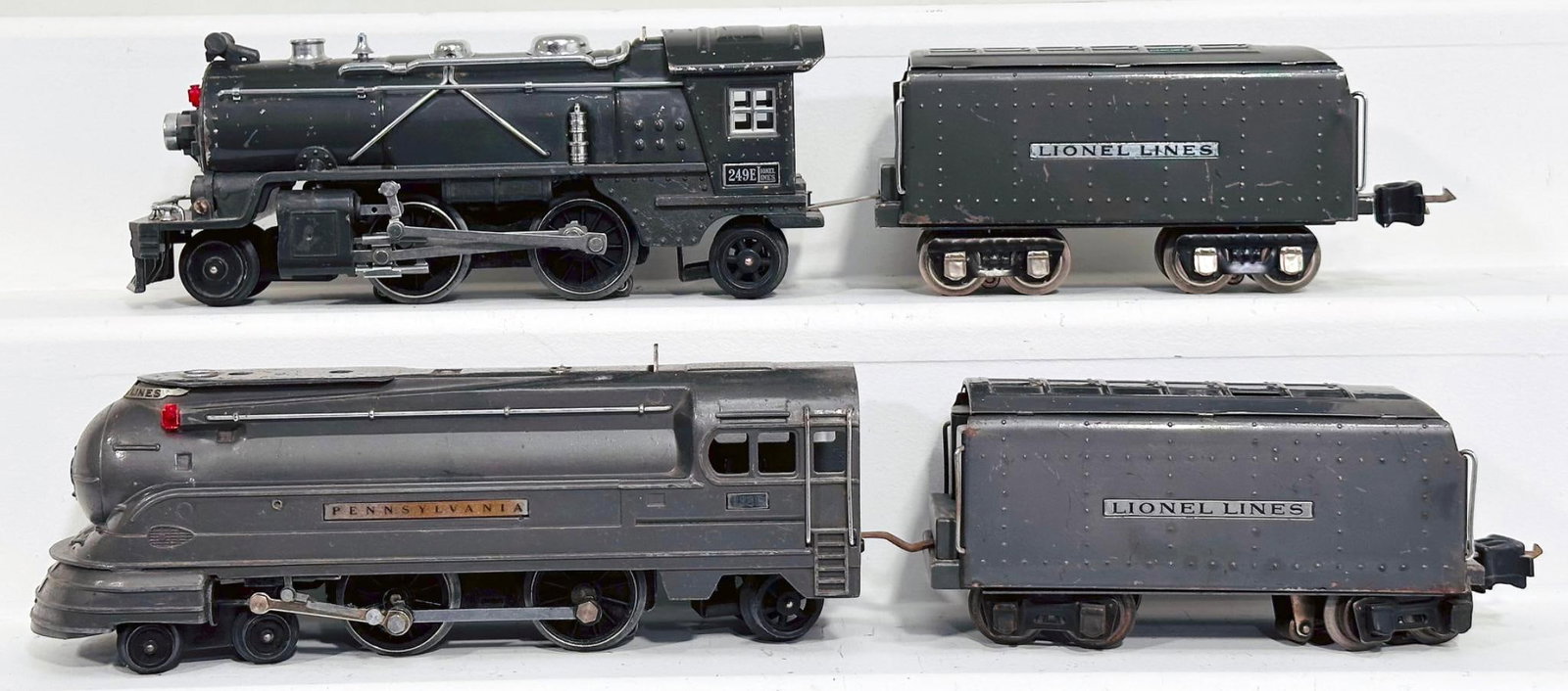 Lionel Prewar O Gauge 238E Streamlined Gunmetal Locomotive and 2225W Tender and 249E Gray Locomotive: Lionel Prewar O Gauge 238E Streamlined Gunmetal Locomotive and 2225W Tender and 249E Gray Locomotive and 265W Tender, each in C6 or better.