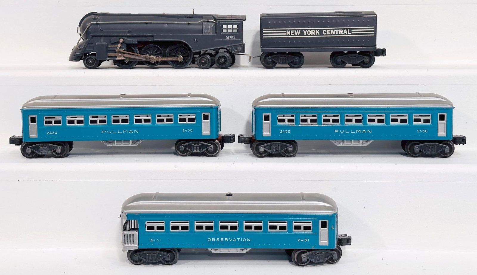 Lionel Postwar O Gauge 221 Gray New York Central Locomotive and Tender/2430-2430-2431 Passenger Cars: Lionel Postwar O Gauge 221 Gray New York Central Locomotive and Tender and 2430 - 2430 - 2431 Passenger Cars, in C7 minus or better.