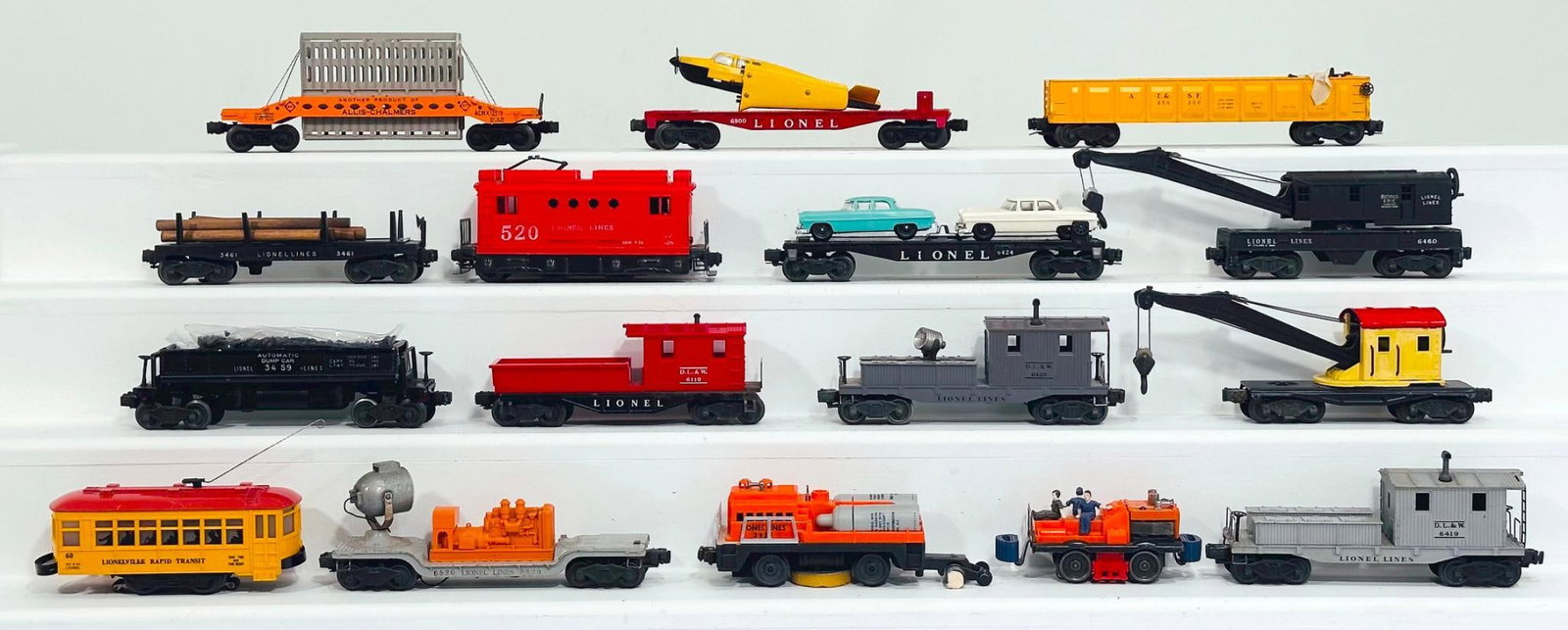 Lionel Postwar O Gauge Twelve (12) Assorted Freight Cars/60 Trolley/Track Cleaning Car/Bumper Car: Lionel Postwar O Gauge Twelve (12) Assorted Freight Cars/60 Trolley/Track Cleaning Car/Bumper Car, each in C7 minus or better.