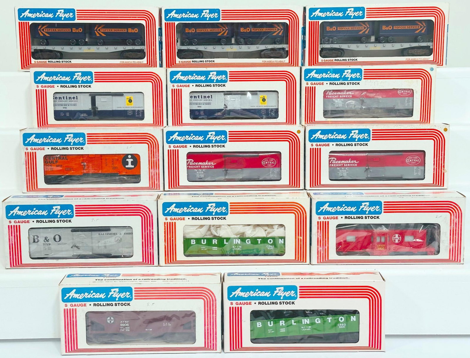 American Flyer Lionel Modern S Gauge Fourteen (14) Assorted Freight Cars Boxed: American Flyer Lionel Modern S Gauge Fourteen (14) Assorted Freight Cars Boxed, including Baltimore and Ohio Box Car X3, Baltimore and Ohio Flat Car with Vans X3, New Central Box Car X3, Burlington