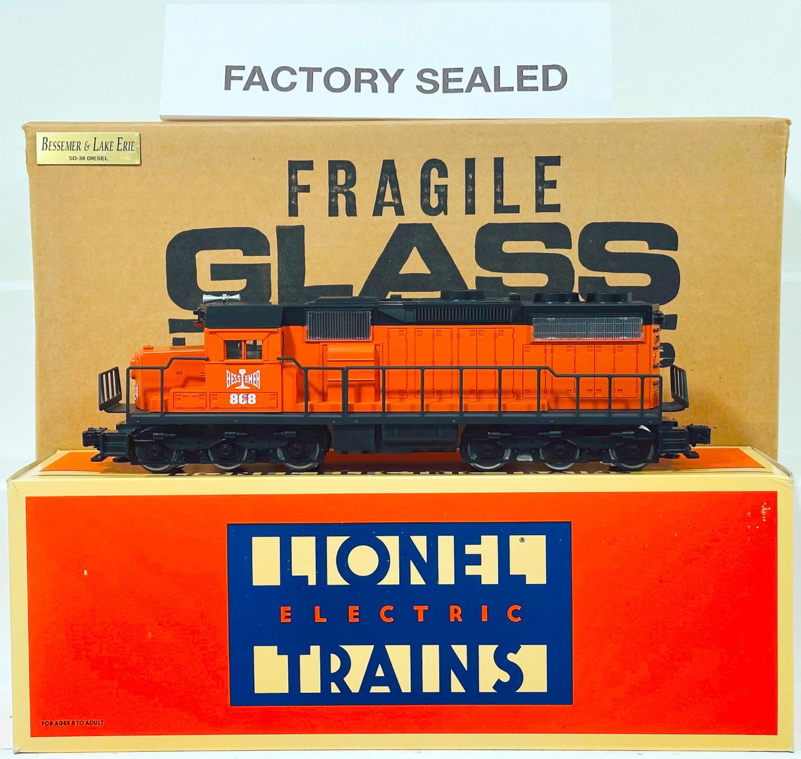 Lionel Modern O Gauge Bessemer & Lake Erie SD - 38 Diesel Switcher Boxed with Plexiglass Showcase: Lionel Modern O Gauge Bessemer & Lake Erie SD - 38 Diesel Switcher Boxed with Plexiglass Showcase, in C9 and with its original box. This Lot also comes with a plexiglass showcase with wood/truck base