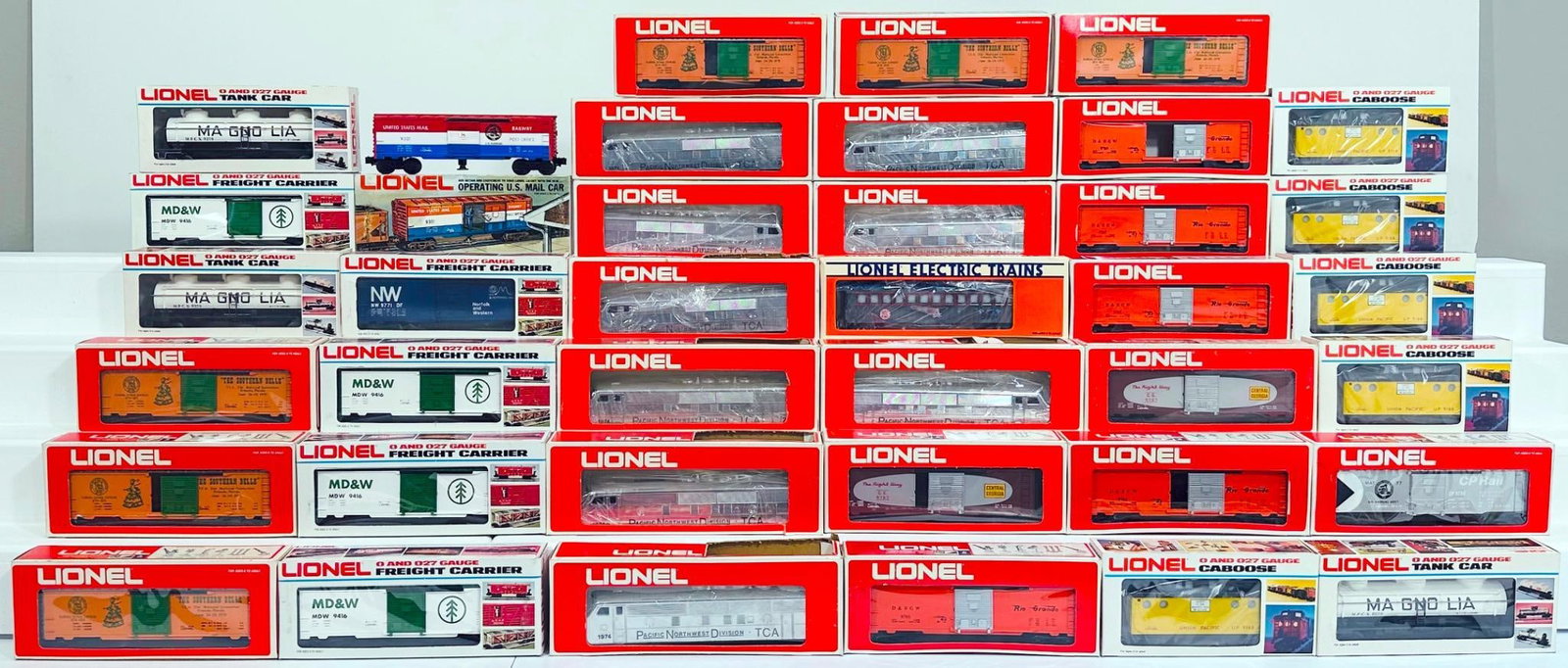 Lionel Modern O Gauge Thirty-eight (38) Assorted Freight Cars Boxed: Lionel Modern O Gauge Thirty-eight (38) Assorted Freight Cars Boxed, including Union Pacific Lighted Caboose X4, each in C9 and each with its original box, Denver RG Box Car X4, each in C9 and each wi