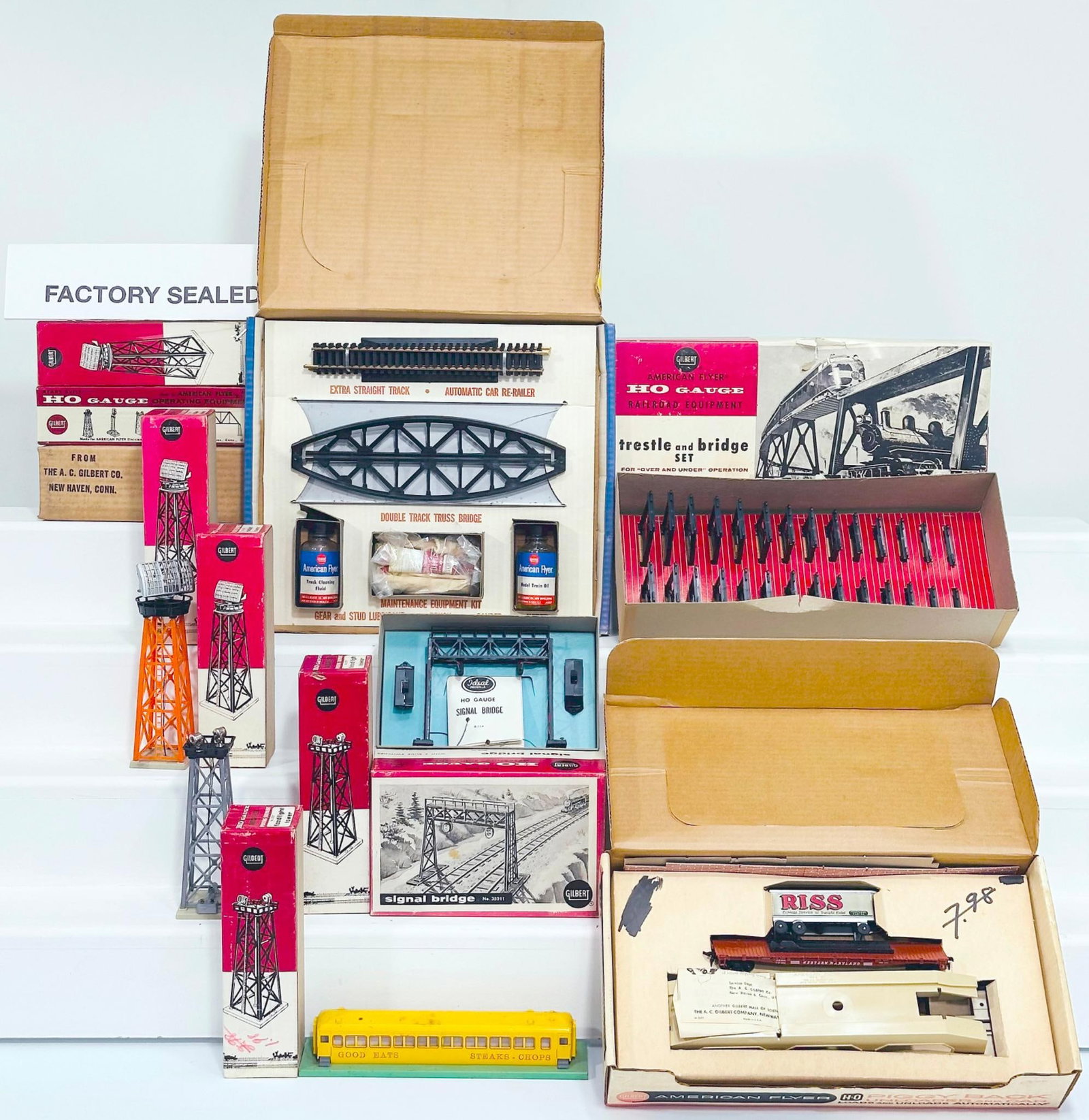 American Flyer Postwar HO Scale Assorted Accessories Boxed: American Flyer Postwar HO Scale Assorted Accessories Boxed, including Floodlight Tower X2, Radar Tower X3, Signal Bridge, Crossing Gate, Roadside Diner, each in C8 or better and each with original box