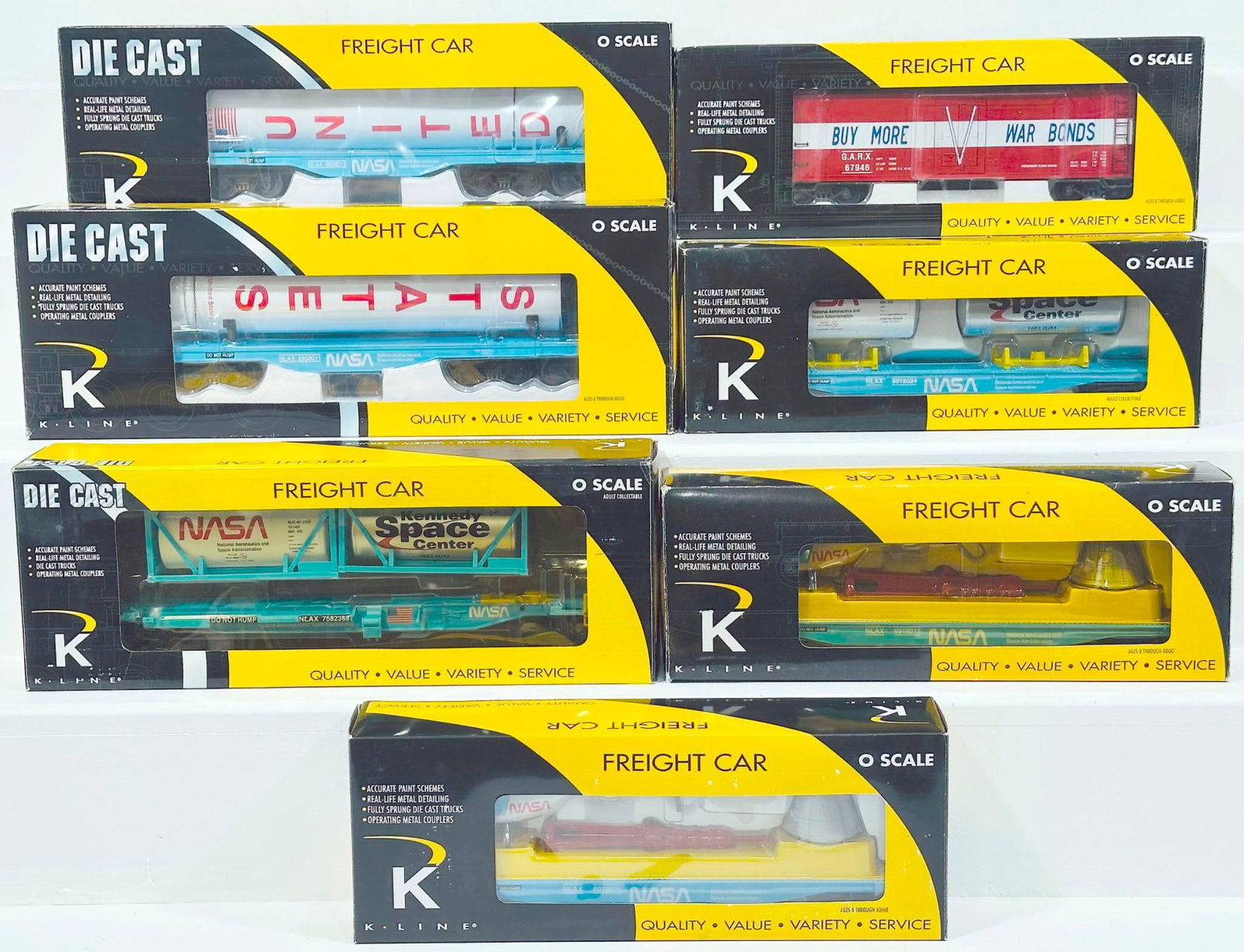 K-Line Modern O Gauge Seven (7) Assorted Freight Cars Boxed: K-Line Modern O Gauge Seven (7) Assorted Freight Cars Boxed, including Buy More War Bonds Classic Reefer, NASA Front Runner with two (2) NASA tanks, NASA Diecast Flat Car with rocket booster X2, NASA 