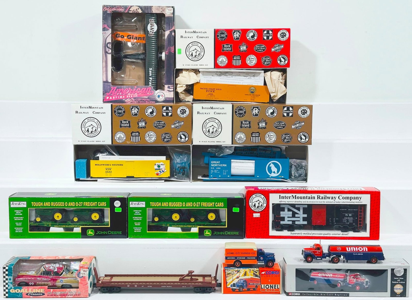 MTH Rail King O Modern O Gauge John Deere Flat Car with 4010 Tractors X2 Boxed and other: MTH Rail King O Modern O Gauge John Deere Flat Car with 4010 Tractors X2 Boxed and other miscellaneous items, each in C9 and each with its original box.