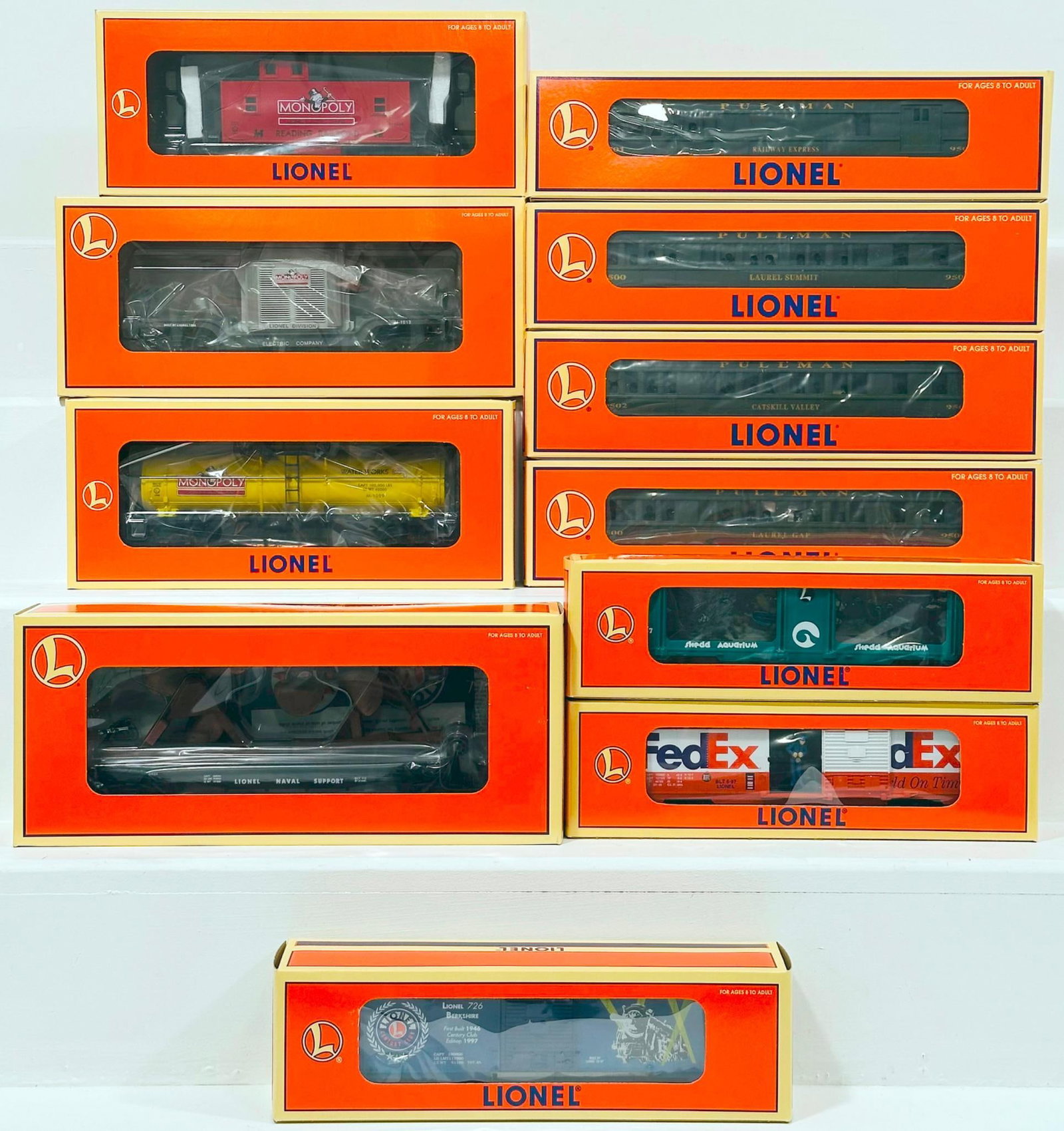Lionel Modern O Gauge Eleven (11) Assorted Freight Cars Boxed: Lionel Modern O Gauge Eleven (11) Assorted Freight Cars Boxed, including Monopoly Electric Company Transformer Car, Monopoly Reeding Willow Caboose, Monopoly Waterworks Single Dome Car, Pullman Bay Ma