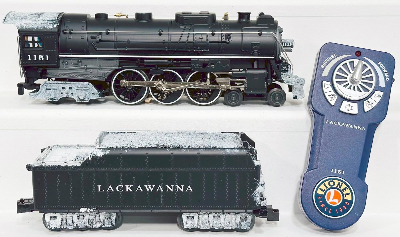 Lionel Modern Gauge 4 - 6 - 4 Lackawanna Locomotive and Tender: Lionel Modern Gauge 4 - 6 - 4 Lackawanna Locomotive and Tender, in C6 because of corrosion to the wheel sets, and includes its original packaging. Please review the pictures closely for this item, the