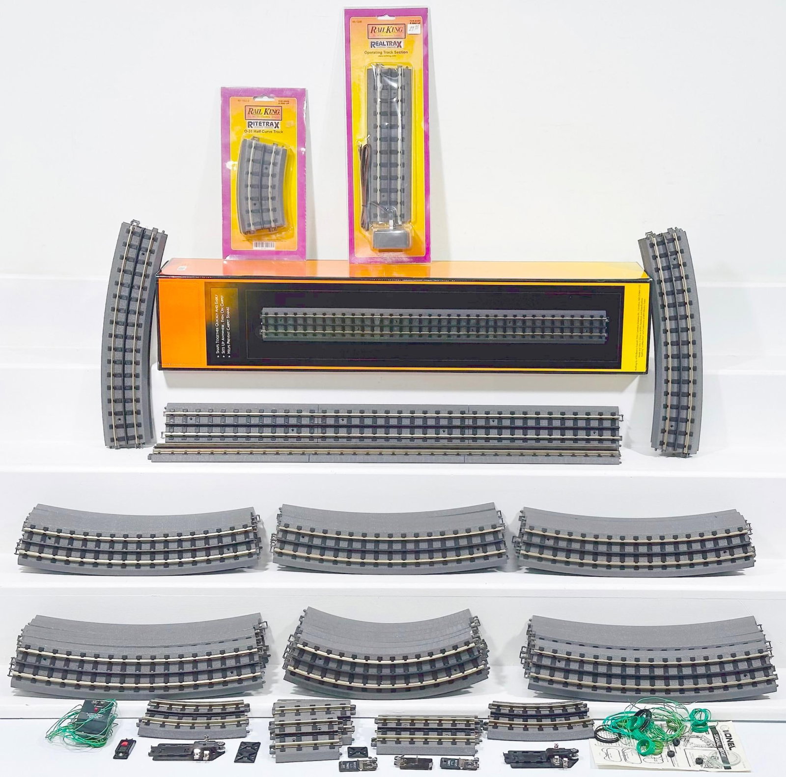 MTH Modern Rail King RealTrax 30 inch Straight Sections Boxed: MTH Modern Rail King RealTrax 30 inch Straight Sections Boxed, in C9 and with its original box. This Lot also includes miscellaneous track sections, including one 3.5 inch straight track, two 4.25 in