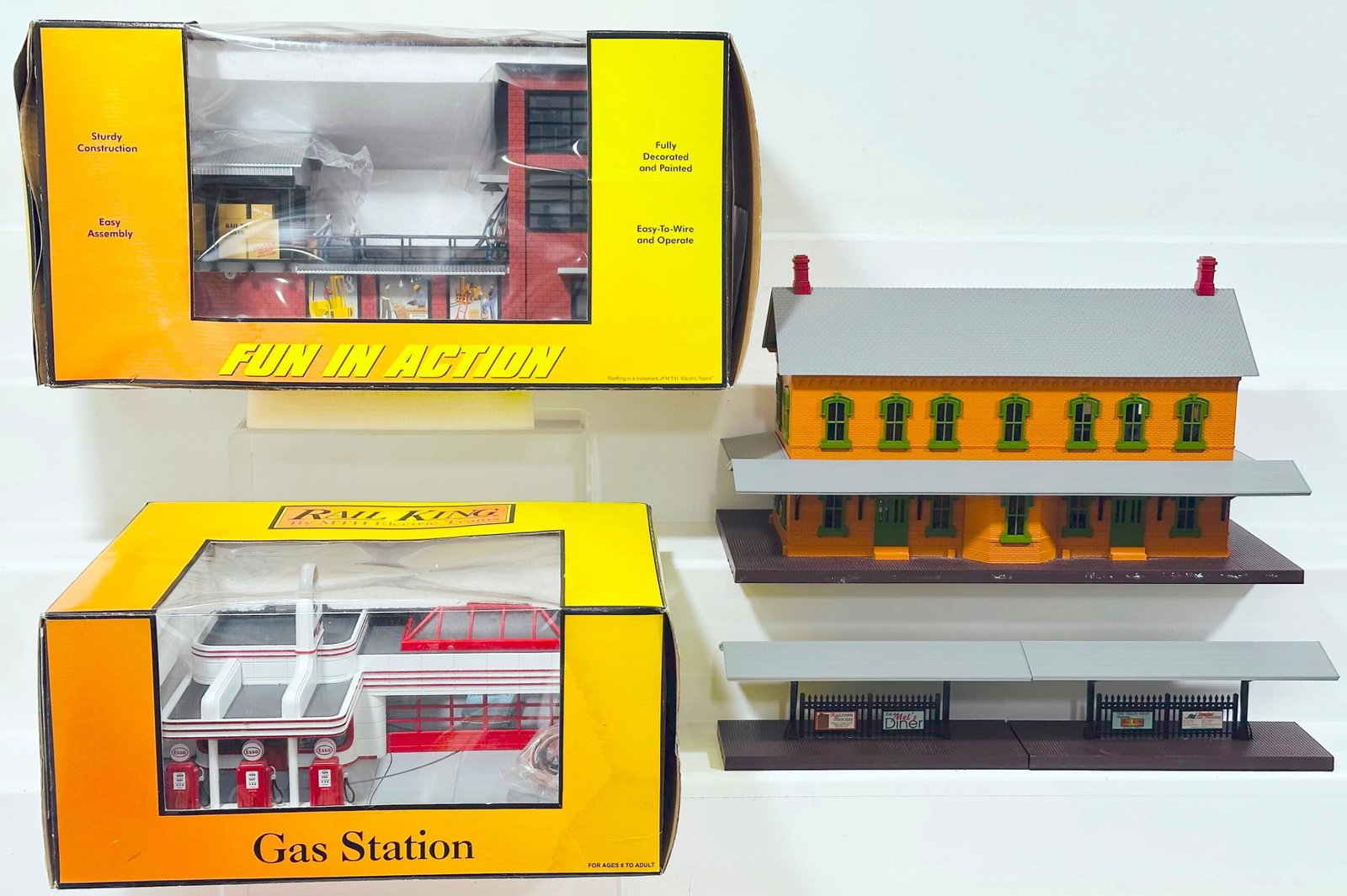 MTH Modern O Gauge Operating Transfer Dock/Esso Operating Gas Station/ Two Story Factory Building: MTH Modern O Gauge Operating Transfer Dock/Esso Operating Gas Station/ Two Story Factory Building, each in C9 and original boxes for the Operating Transfer Dock and the Esso Operating Station.