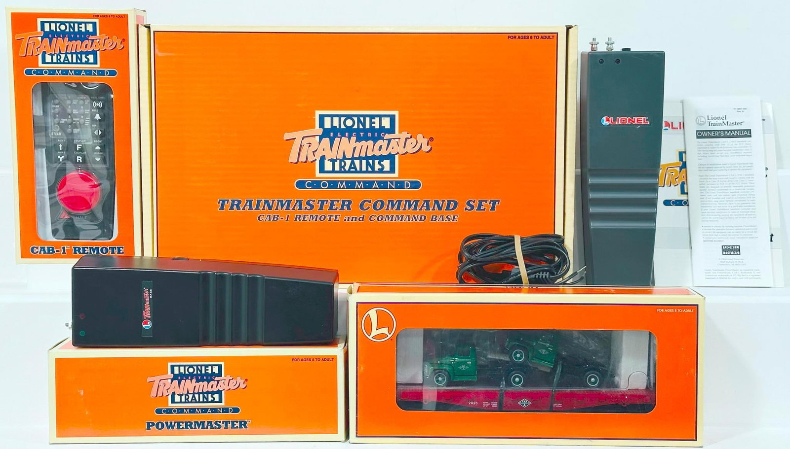 Lionel Modern O Gauge Trainmaster Command Set/CB -1 Remote and Command Base/Trainmaster Power Master: Lionel Modern O Gauge Trainmaster Command Set - CB - 1 Remote and Command Base - Trainmaster Power Master and Diamond T Flat Car with Mack Trucks, each in C9 and each with its original box.