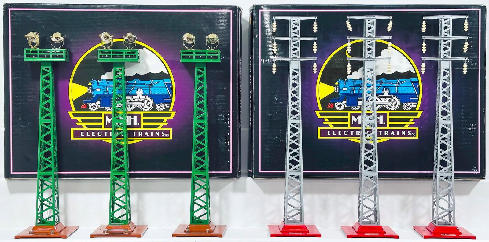 MTH Modern Tinplate Traditions No. 92 Floodlight Tower Set and No. 94 Hi - Tension Tower Set Boxed: MTH Modern Tinplate Traditions No. 92 Floodlight Tower Set and No. 94 Hi - Tension Tower Set Boxed, each in C9 and each with its original box.