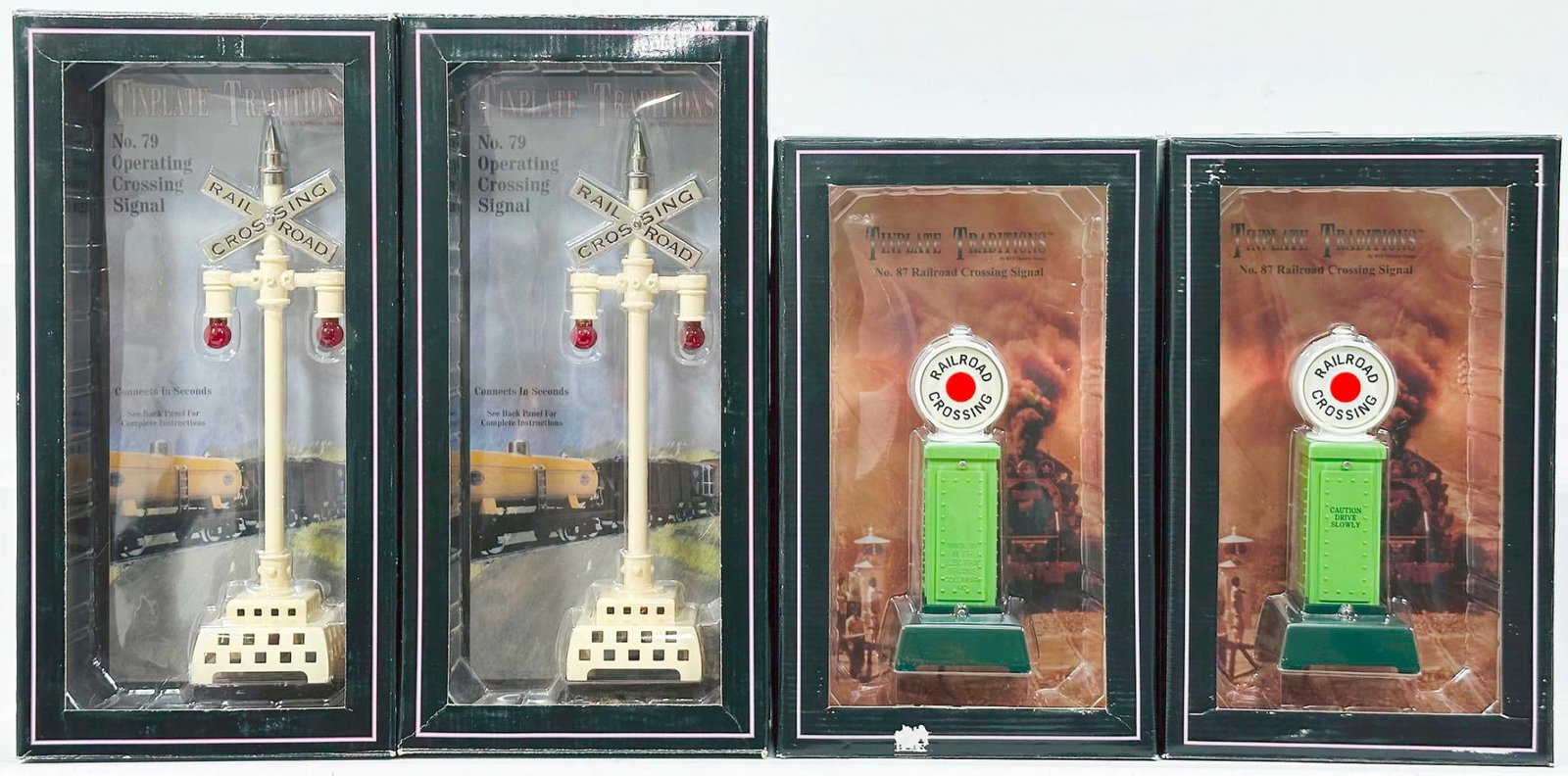 MTH Modern Tinplate Traditions Standard Gauge No. 79 Flashing Highway Signal Boxed X2 and No. 87: MTH Modern Tinplate Traditions Standard Gauge No. 79 Flashing Highway Signal Boxed X2 and No. 87 Railroad Crossing Signal Boxed X2, each in C9 and each with its original box.