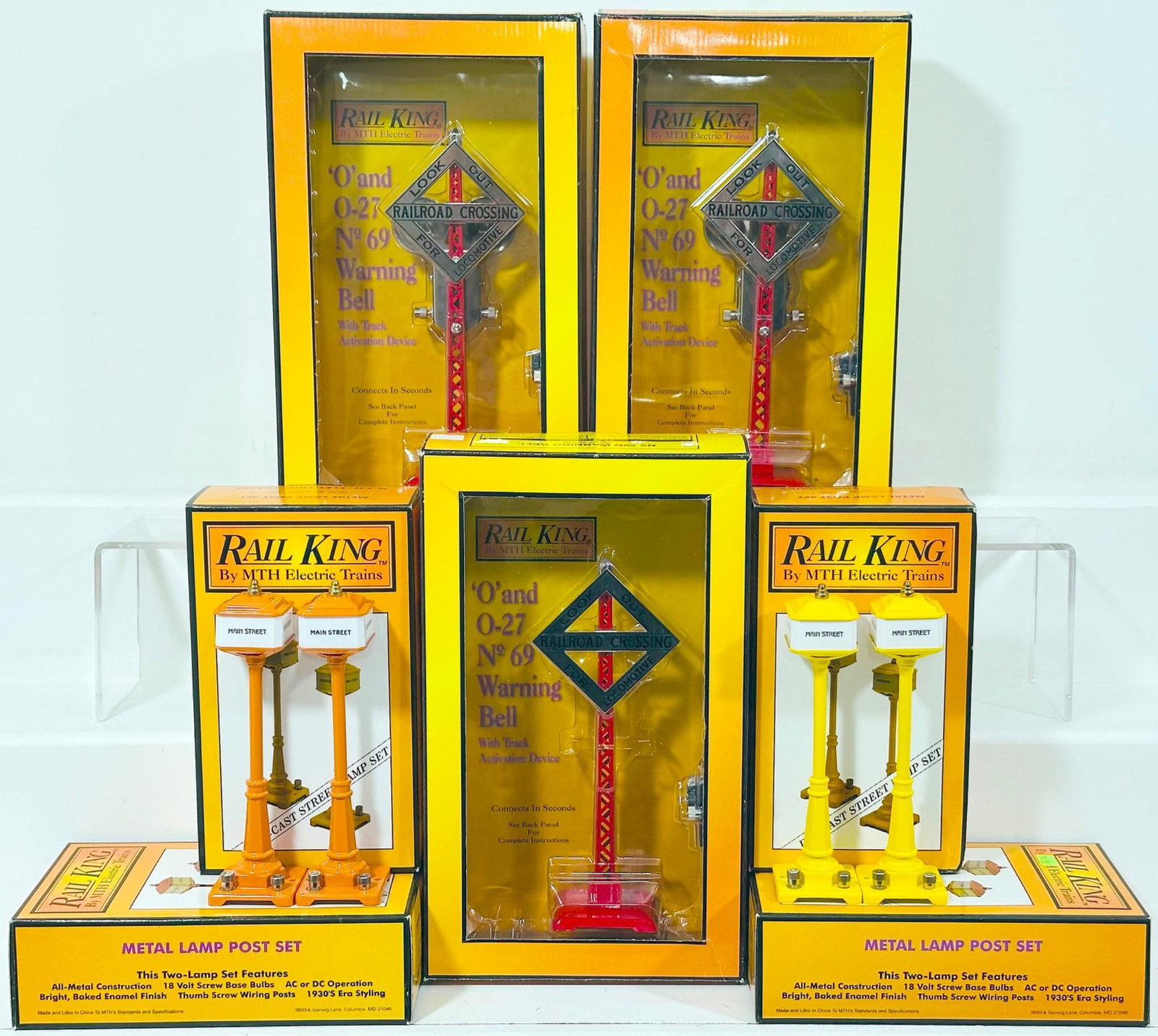 MTH Modern Rail King Standard Gauge No. 69N Warning Bell Boxed X3 and 57 Orange Street Lamp Boxed X2: MTH Modern Rail King Standard Gauge No. 69N Warning Bell Boxed X3 and 57 Orange Street Lamp Boxed X2 and 57 Yellow Street Lamp Boxed X2, each in C9 and each with its original box.
