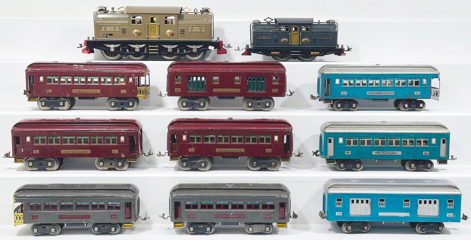 Lionel Prewar Standard Gauge Assorted Passenger Cars and 402 Electric Locomotive, including silver: Lionel Prewar Standard Gauge Assorted Passenger Cars and 402, including silver and blue 309/310/312, each in C4 plus or better. Also includes maroon 322 - 319 - 320 -319 Passenger Cars, each in C4 plu