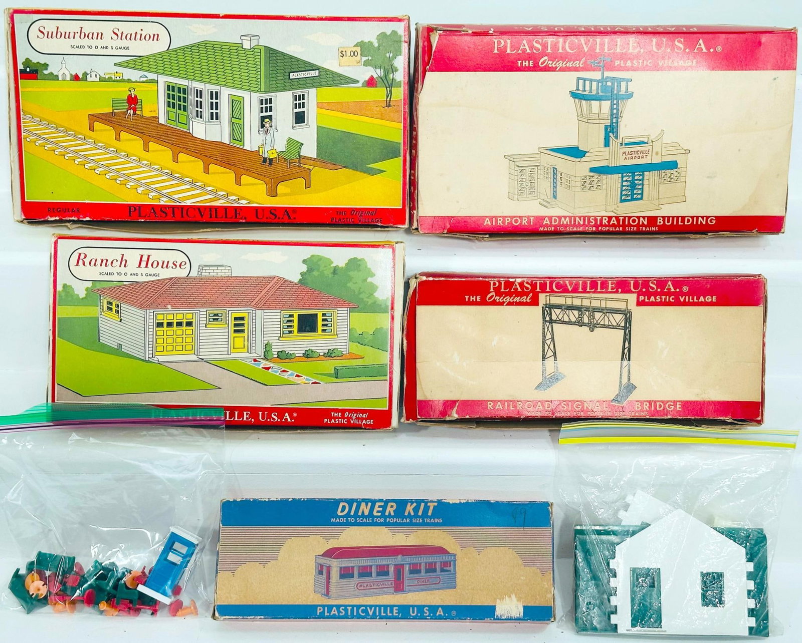 Bachmann/Plasticville Modern and Postwar O Gauge Five (5) Assorted Kits Boxed and Two (2) Assorted: Bachmann/Plasticville Modern and Postwar O Gauge Five (5) Assorted Kits Boxed and Two (2) Assorted Kits Unboxed, each in C7 to C8, and 5 with original boxes.