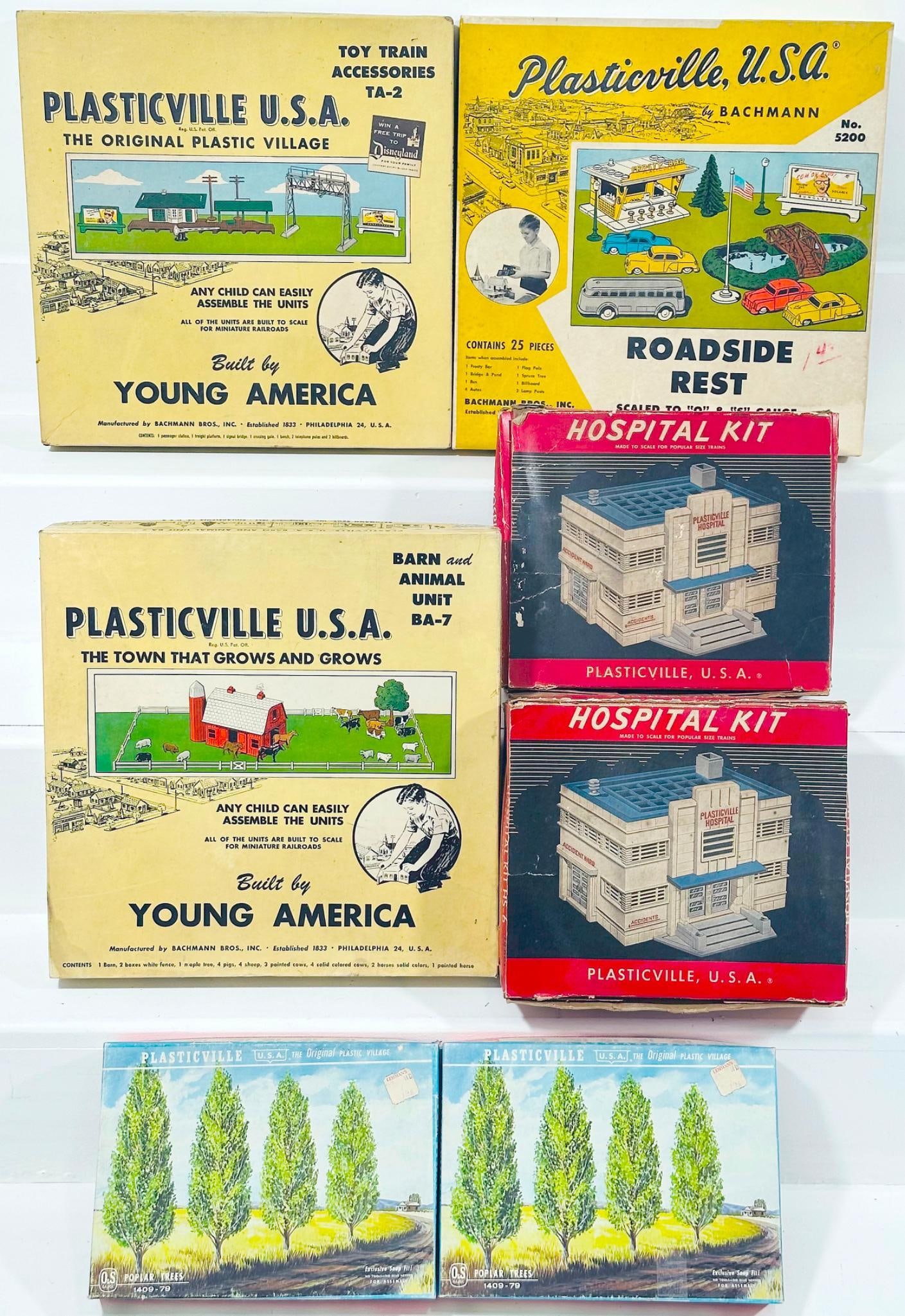 Bachmann/Plasticville Postwar and Modern O Gauge Seven (7) Assorted Kits Boxed: Bachmann/Plasticville Postwar and Modern O Gauge Seven (7) Assorted Kits Boxed, each in C8 and each with its original box.