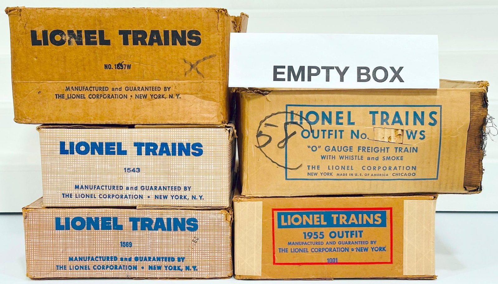 Lionel Postwar O Gauge Outfit No. ? WS - 1001 - 1543 - 1569 - 1637W? original Set Boxes only: Lionel Postwar O Gauge Outfit No. ? WS - 1001 - 1543 - 1569 - 1637W? original Set Boxes only, with the ? WS and showing heavy damage, the 1001 showing moderate damage and tape repair at the corner cor