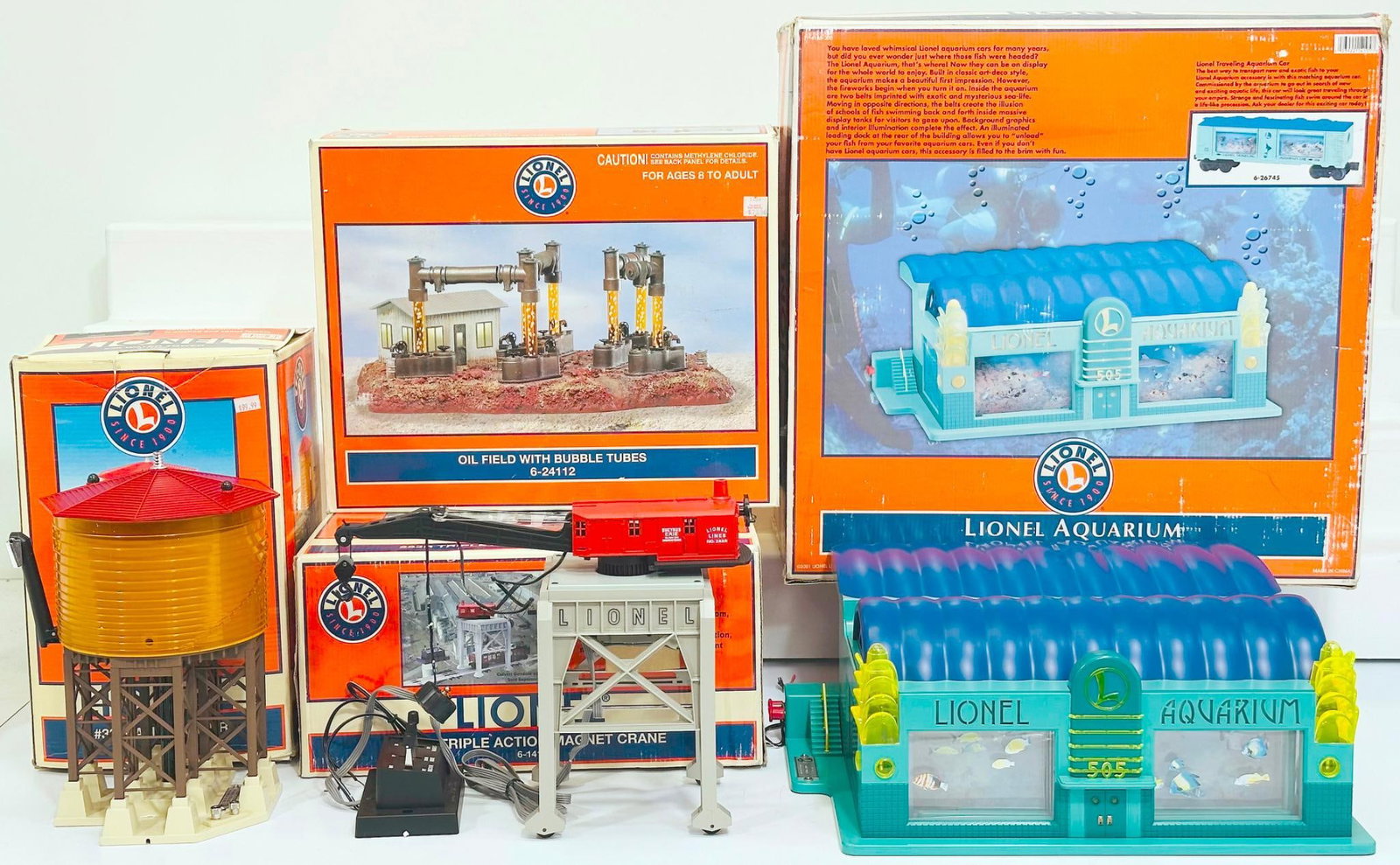 Lionel Modern O Gauge Oilfield with Bubble Tubes - Lionel Aquarium - 282R Triple Action Magnet Crane: Lionel Modern O Gauge Oilfield with Bubble Tubes - Lionel Aquarium - 282R Triple Action Magnet Crane - #38 Water Tower Boxed, each in C7 plus to C8 minus, and each with its original box, although some