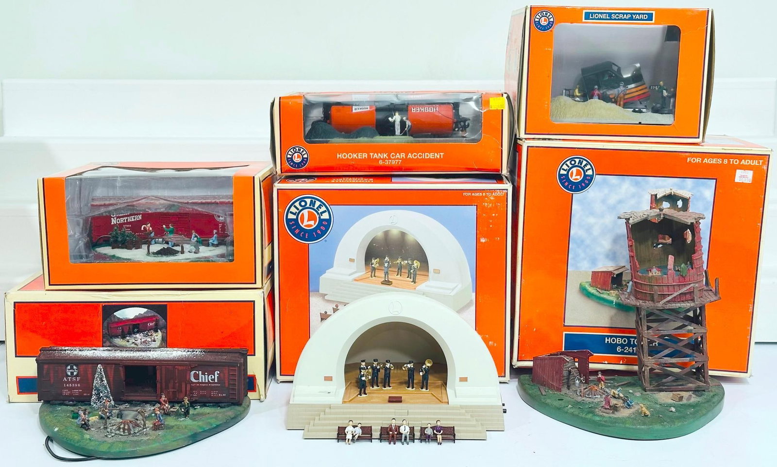 Lionel Modern O Gauge Hobo Hotel -Lionelville Band Shell Union-Christmas Hobo Hotel-Lionel Scrapyard: Lionel Modern O Gauge Hobo Hotel - Lionelville Band Shell Union - Christmas Hobo Hotel - Lionel Scrapyard - Hooker Tank Car Accident - Hobo Tower Boxed, each in C7 or better and each with its original