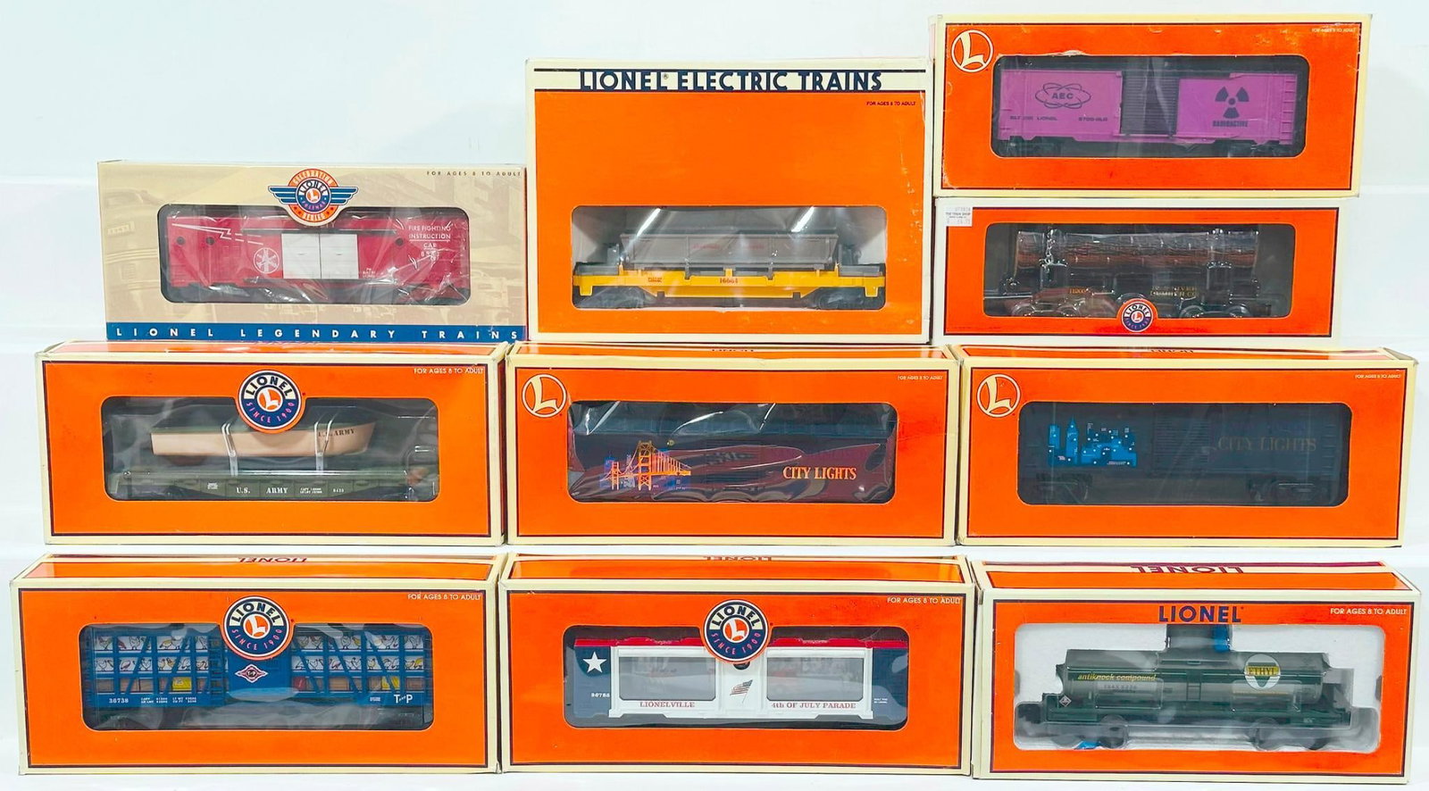 Lionel Modern O Gauge Ten (10) Assorted Freight Cars Boxed: Lionel Modern O Gauge Ten (10) Assorted Freight Cars Boxed, including Glow In the Dark AEC Box Car, Operating Parade Car, Texas & Pacific Poultry Despatch, Firefighting Instruction Car, Louisville & N